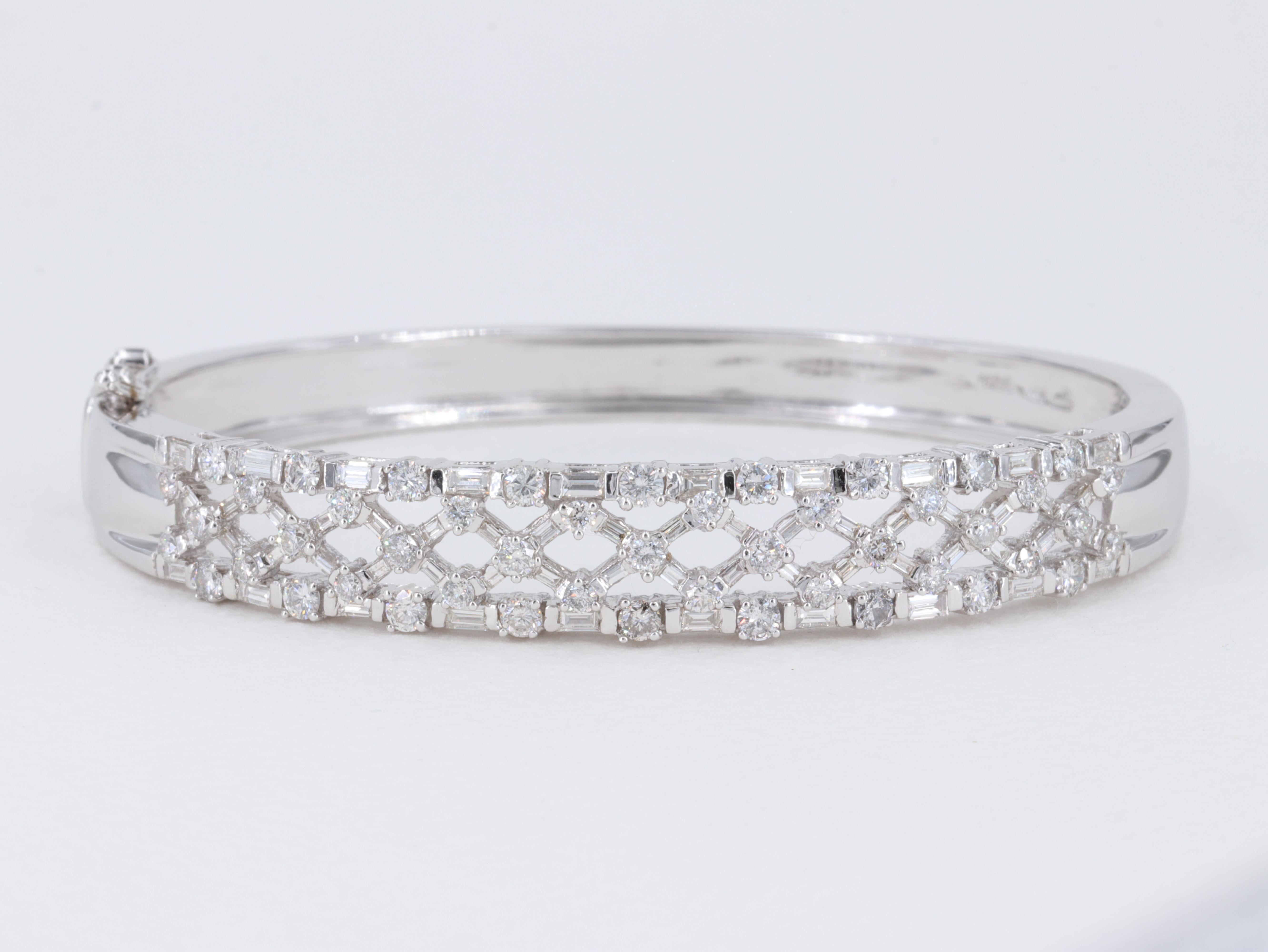 Lattice Baguette and Round Brilliant Cut Diamond and 14 Karat White Gold Hinged Bangle Bracelet   

Diamonds:

Weight - 3.74 Carats 
Shape - Baguette Cut & Round Brilliant Cut Diamonds 
Colors - G to I
Clarities - VS1 to SI1 

Bangle:

Metal - 14