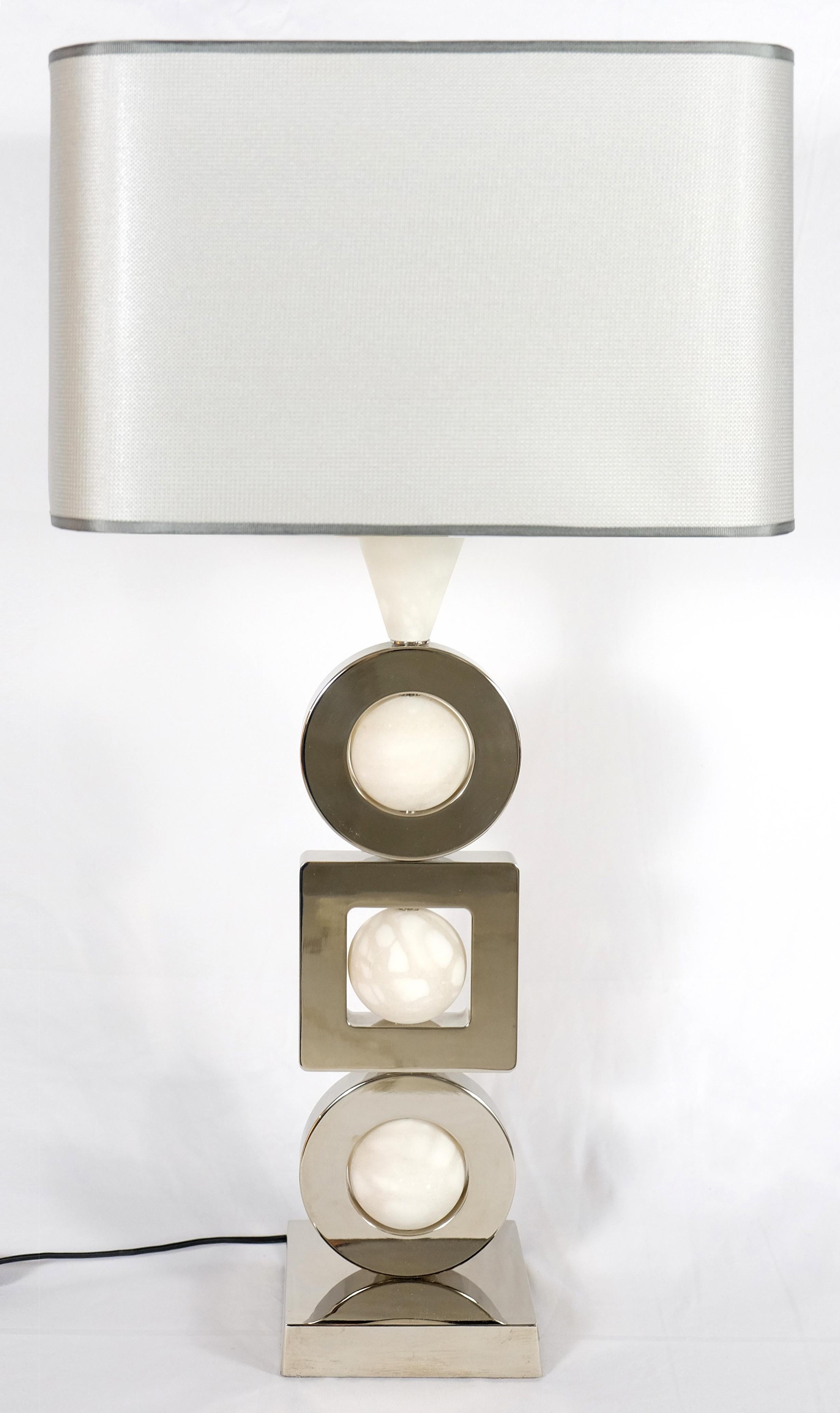 Laudarte Srl Andromeda table lamp by Attilio Amato, pair available offered for sale is a fine quality brass and marble 