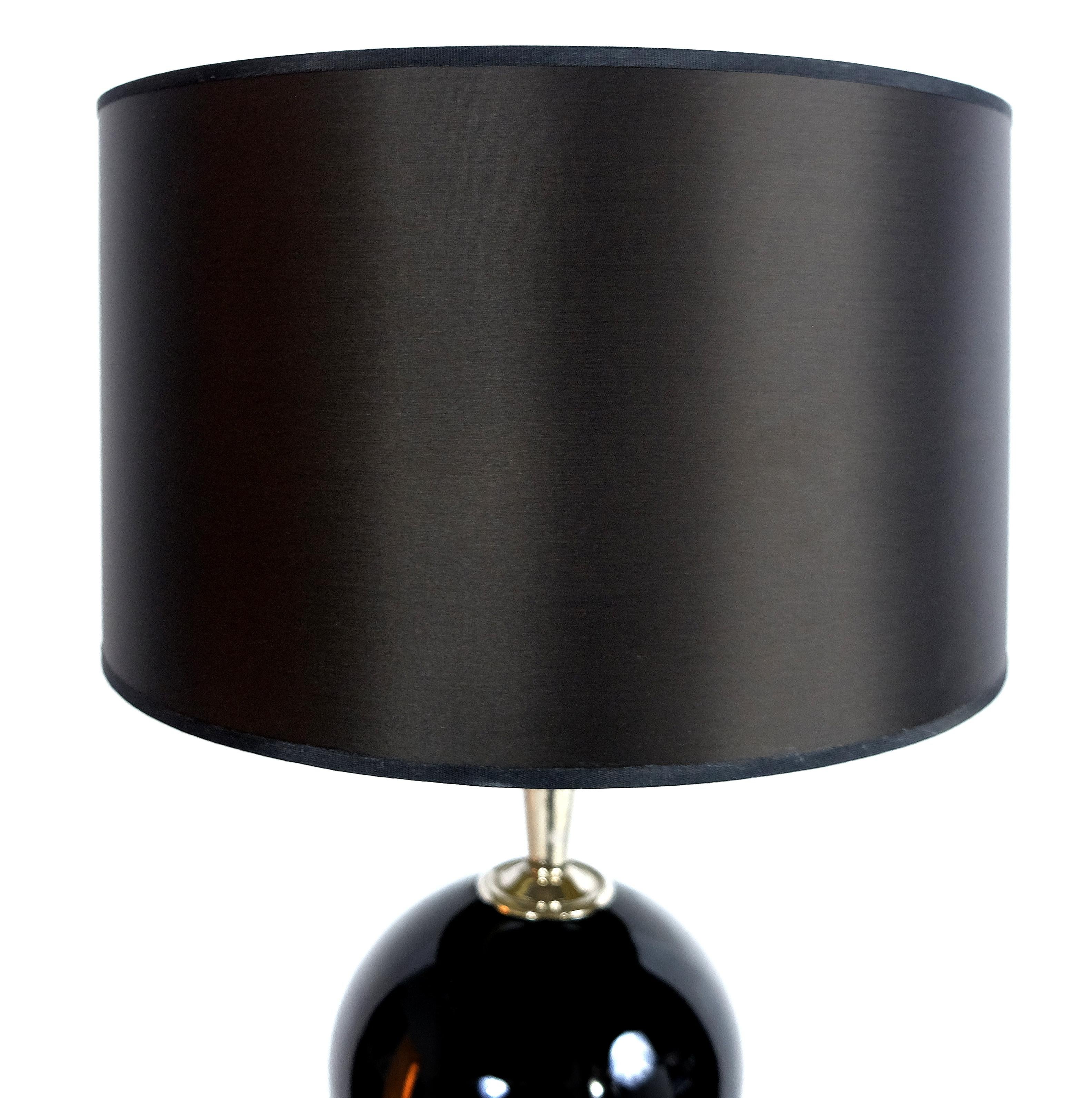 Laudarte Srl Lume Yago table lamp in nickel and glass, pair available offered for sale is a stunning black glass table lamp from Leo Mirai Collezione of Laudarte Srl with a nickel finish. The Leo Mirai collection grew from the prestigious collection