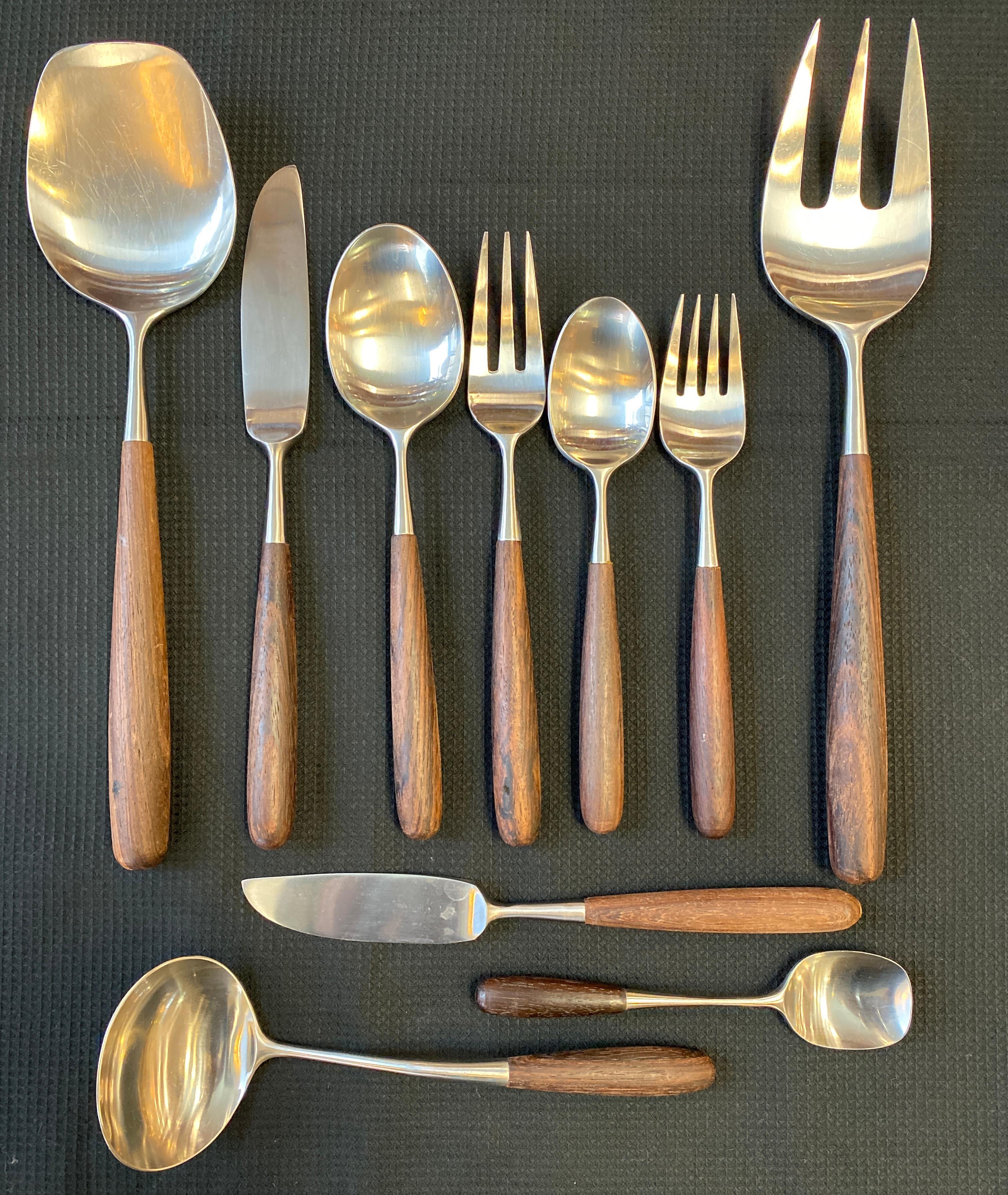Offered here is a Lauffer 51 piece set of flatware made in Japan
Made of stainless steel with Palisander handles.
Stylish and sleek Scandinavian design, with superb craftsmanship 
Enough pieces for 8 place settings.

What is included in this