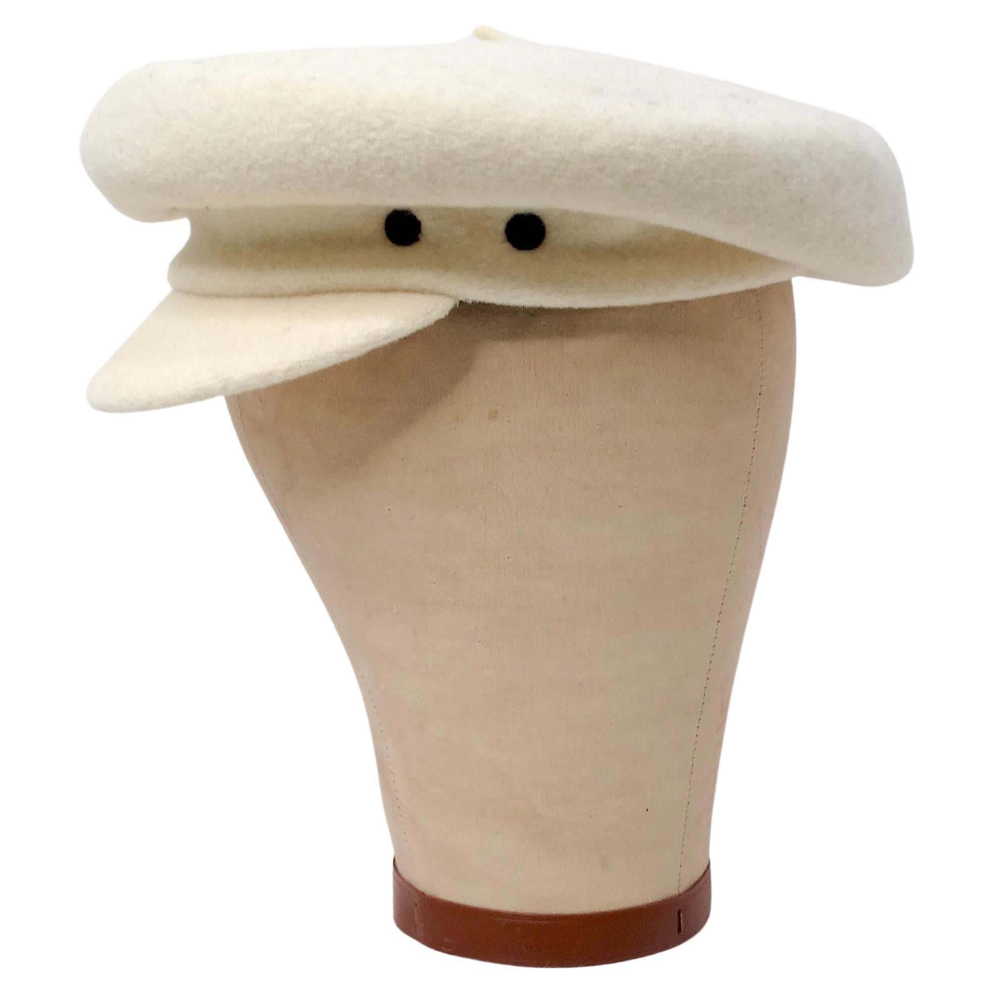 The Laulhere Cream French Merino Wool Bakers Hat Beret is a timeless accessory that combines classic French elegance with exceptional craftsmanship. Crafted from soft, luxurious Merino wool in a delicate cream hue, this beret exudes sophistication