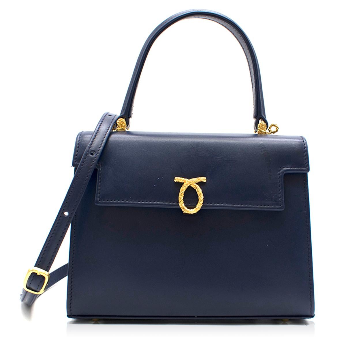 Launer Indigo Judi Leather Tote Bag

- Launer leather tote
- Concealed push clasp fastening
- Optional adjustable shoulder strap
- Top carry handle
- Flap closure
- Gold-toned hardware
- External slip pocket at rear 
- Internal divider with zip