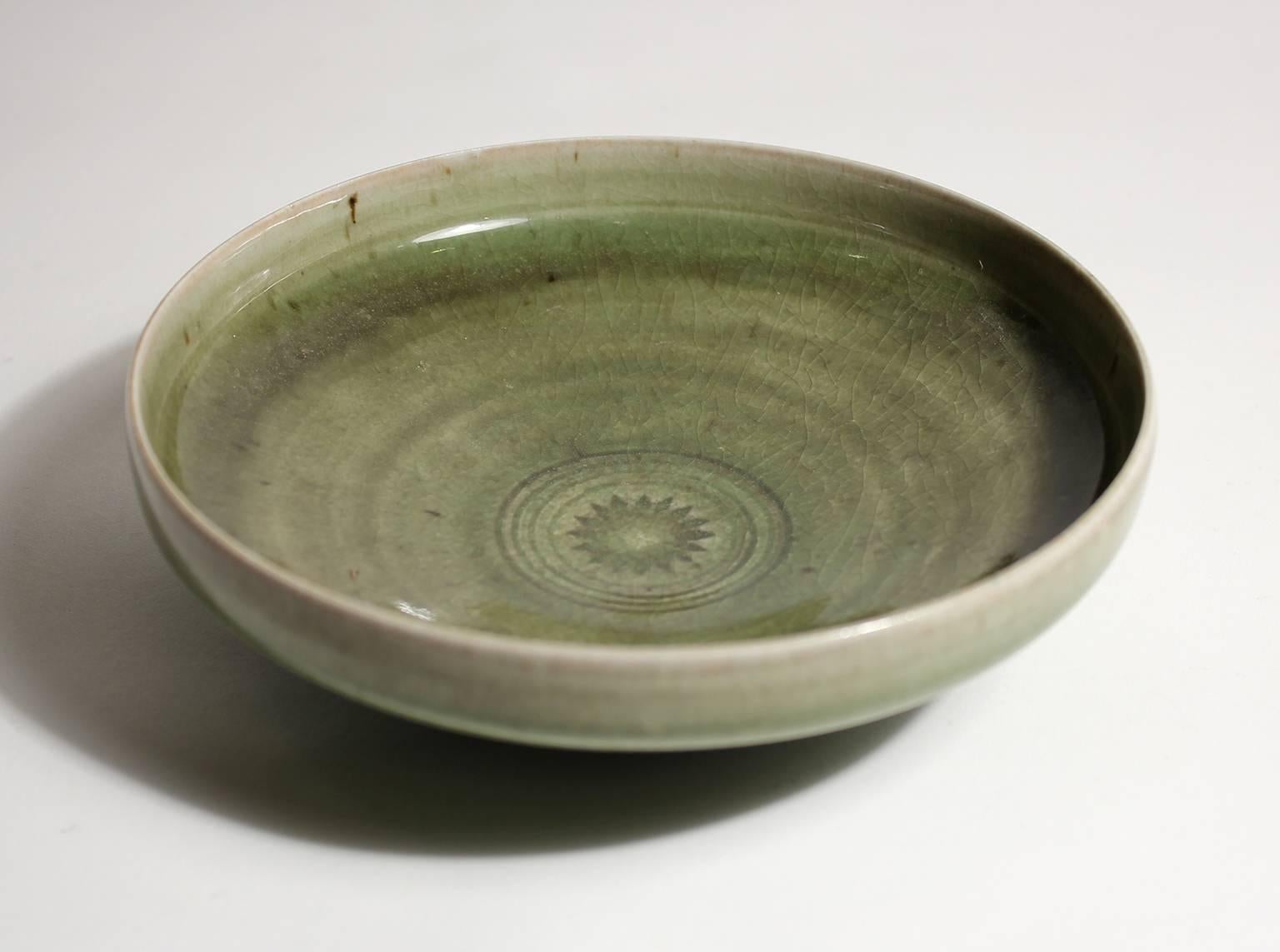 Beautiful signed California artist Laura Andreson celadon green low bowl. Hand thrown by the artist. Measures 6