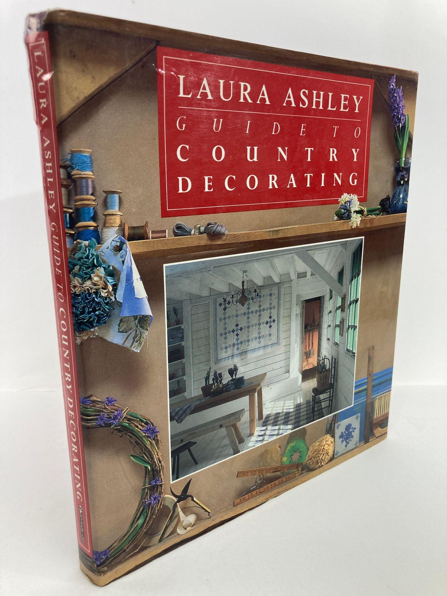 Laura Ashley guide to country decorating. Hardcover book.
The timeless appeal of rustic living, with its emphasis on comfort, function, and simplicity, gets a crisp, contemporary interpretation--in classic Laura Ashley style--now available in trade