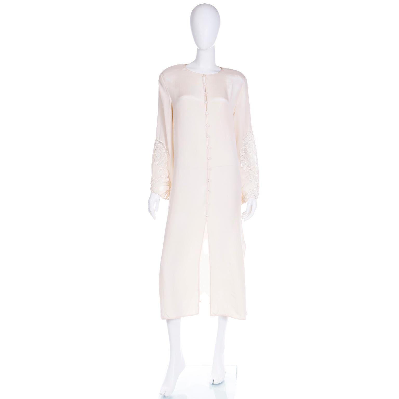 We acquired this pretty vintage Laura Biagiotti ivory satin caftan style dress along with a Laura Biagiotti ivory coat with a mesh overlay that the original owner wore together. The coat is available on 1stdibs as well. The standouts of this dress