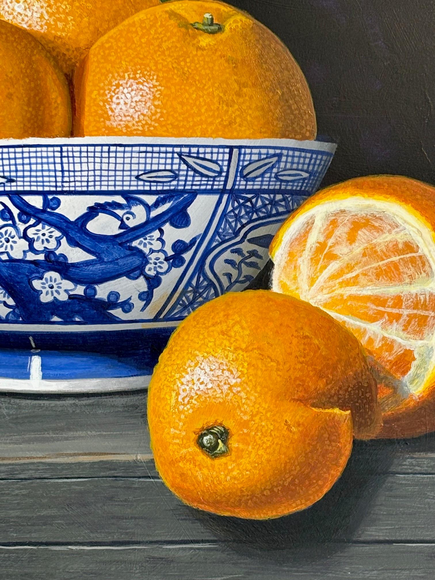 Oranges in a blue bowl - original realism still life acrylic painting art - Black Still-Life Painting by Laura Critchlow
