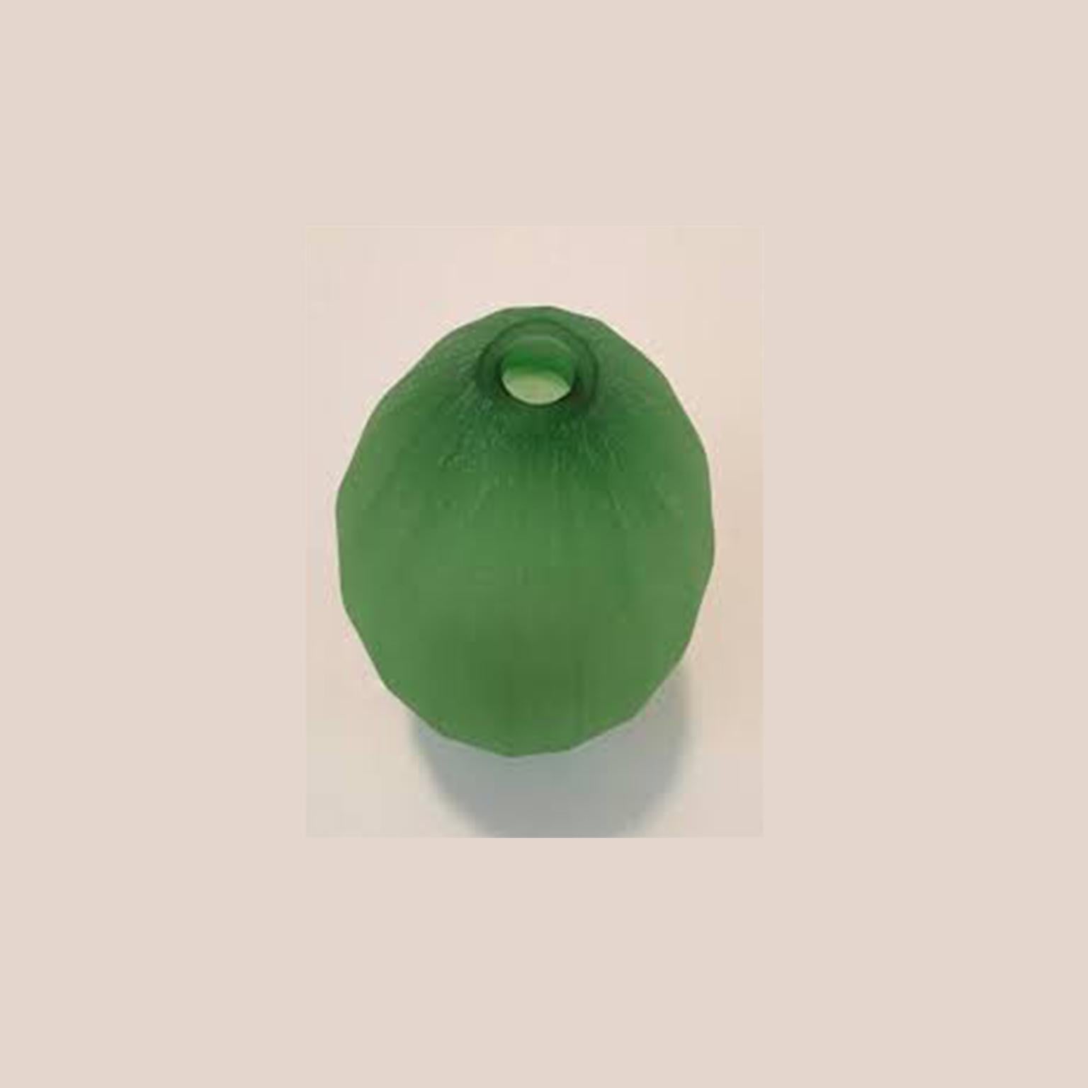 Vase designed by Laura de Santillana in edition for Arcade, 2001. This is from a series of tropical fruit and plant form inspired vases with the same matte, hand engraved, finish:
Papaia, made in three different shades of green. Mango, made in dark