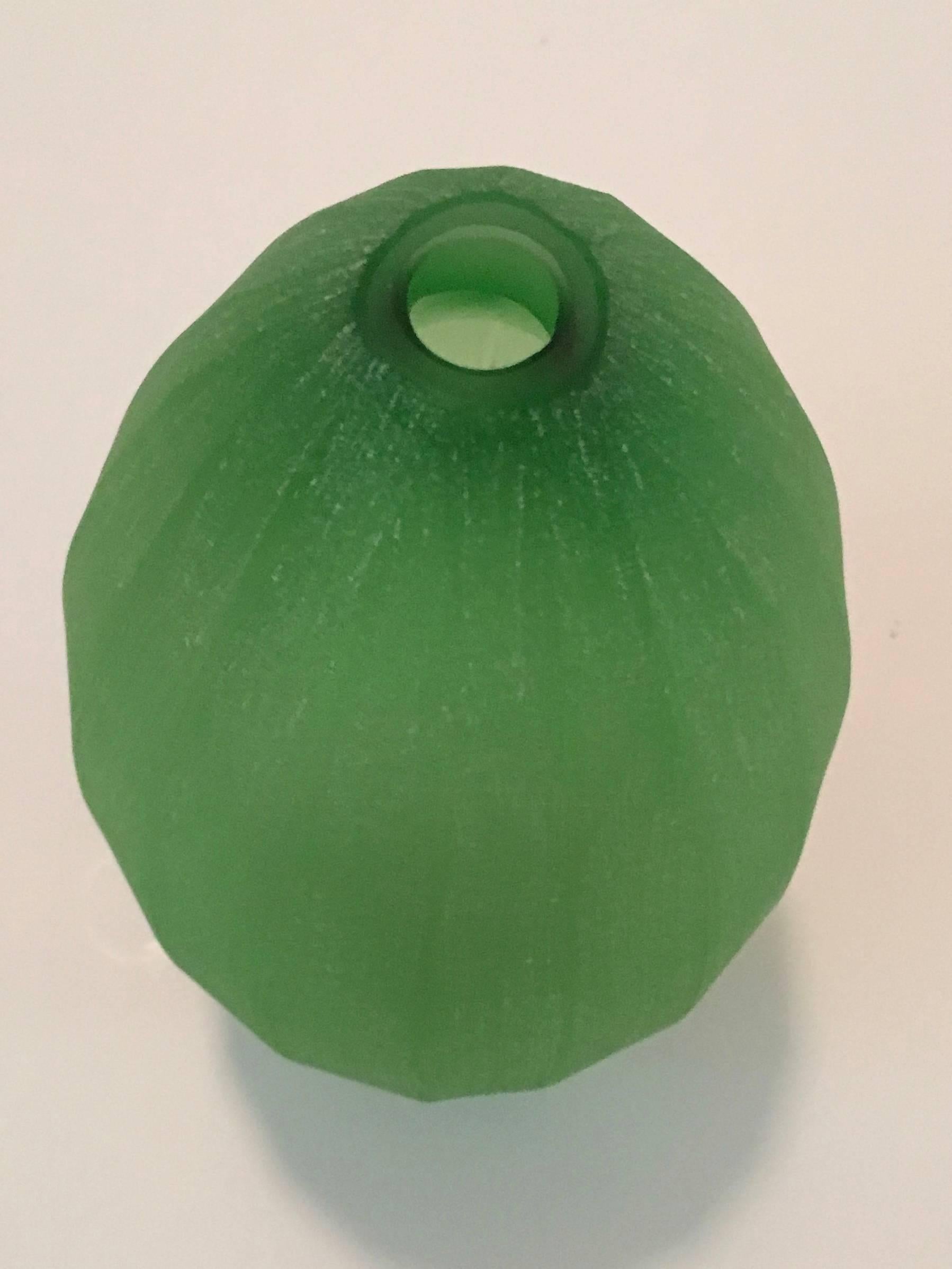 Vase designed by Laura de Santillana in edition for Arcade, 2001. this is from a series of tropical fruit and plant form inspired vases with the same matte, hand engraved, finish:
PAPAIA, made in three different shades of green. MANGO, made in dark