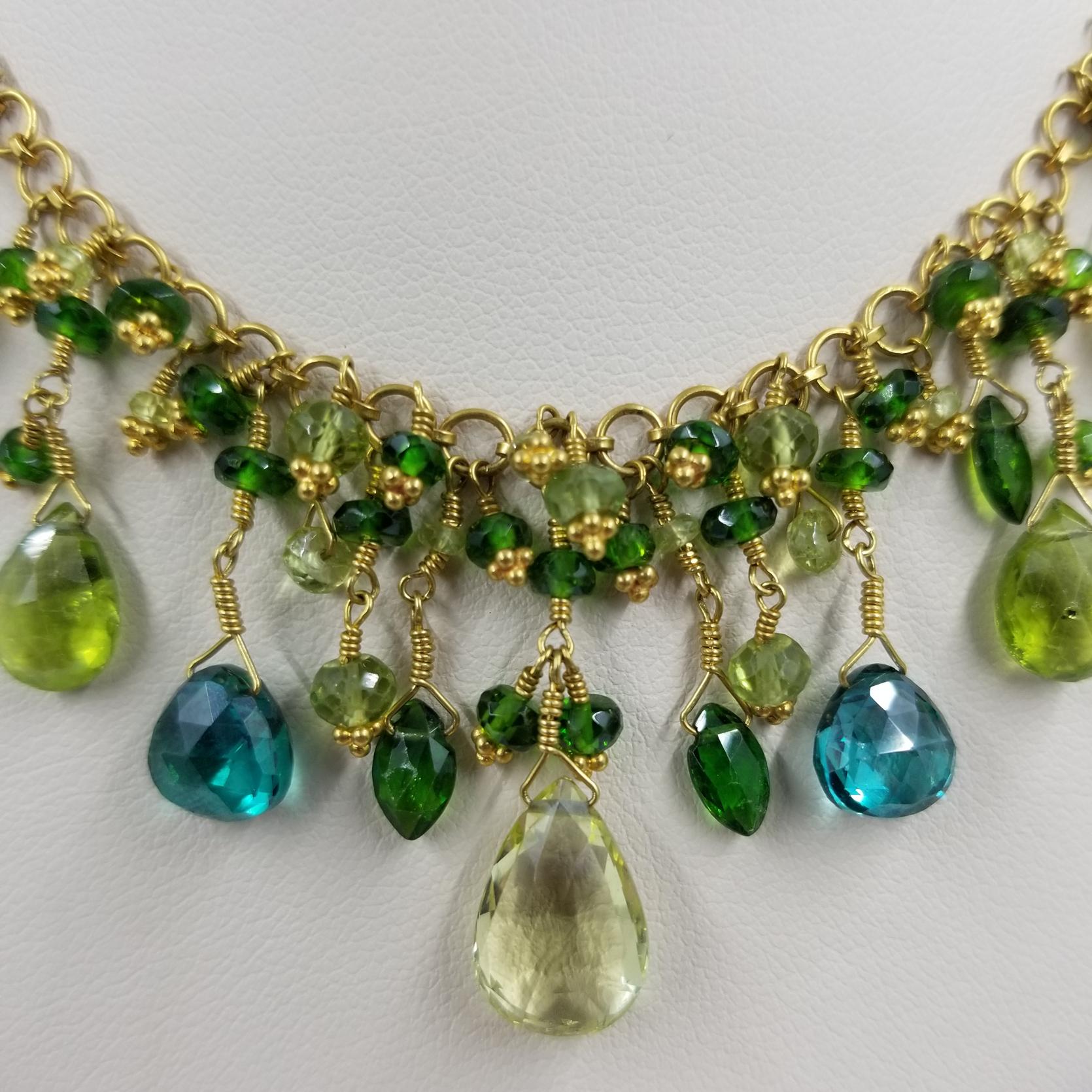 Laura Gibson Multi-Color Gemstone Necklace in 22 Karat Yellow Gold
Lemon & Green Topaz, Peridot, Chrysoberyl, Chrome Diopside, & Lemon Citrine in varying shapes and sizes
39.35 carats total weight
16 inches long
Toggle clasp with designer stamp