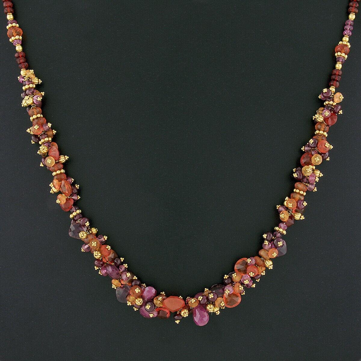 Here we have a beautiful beaded necklace by Laura Gibson, featuring numerous gemstones of different colors and shapes strung throughout. These colored stones are tear drop briolette shape, faceted round beads and checkerboard cushion cut. They offer