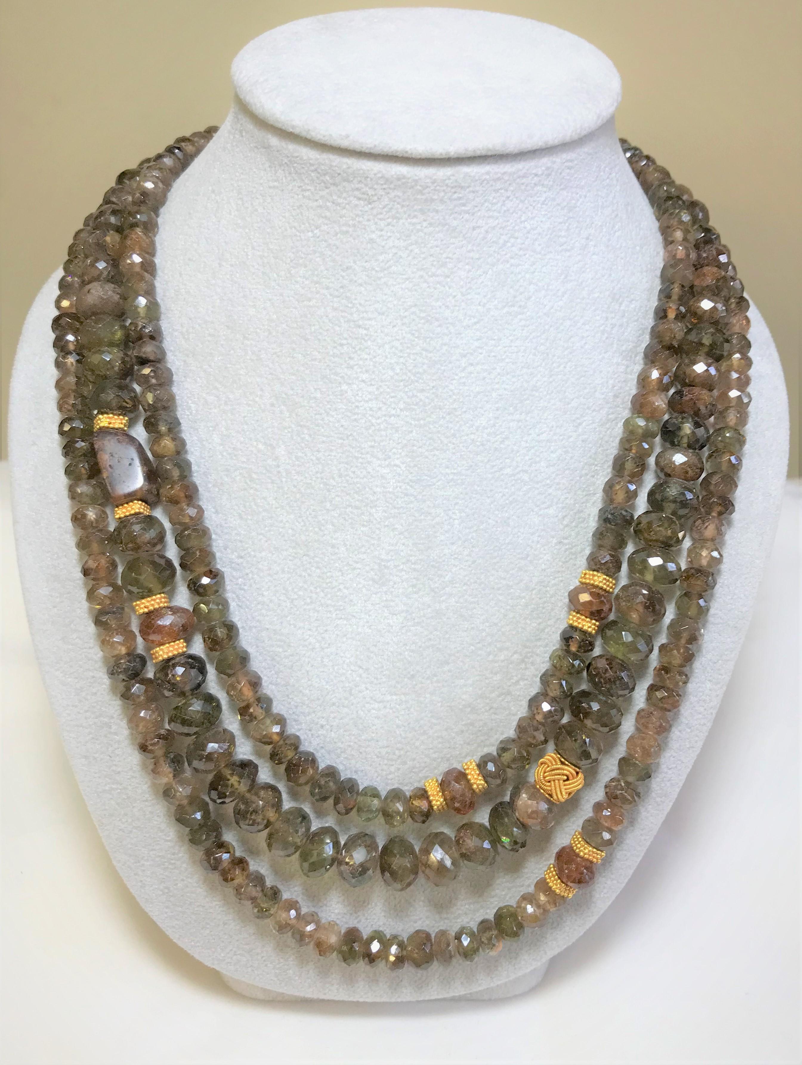 Original Laura Gibson
This three string warm brown beaded necklace is perfect for Fall!
22 karat yellow gold clasp and decorative rondells
Three strands
104 andalusite beads on the longest outer strand, each bead approximately 6mm wide
59 andalusite