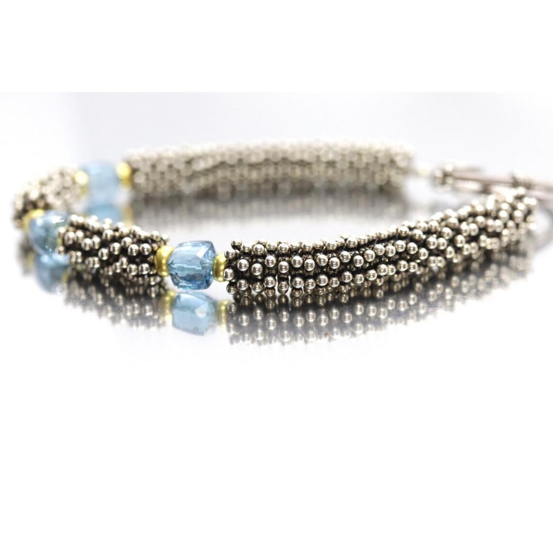 Vintage
Materiali: Pietra
Pietra preziosa: Topazio

Larghezza bracciale: 7 millimetri; Lunghezza bracciale: 7,25 pollici

Incredibile bracciale di Laura Gibson & Gibson. Maglie e chiusura in argento sterling con perline da 18k. Dolci gemme di