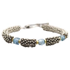 Laura Gibson Bracelet. Sterling Silver and 18k Beads with Dangling Faceted Gems