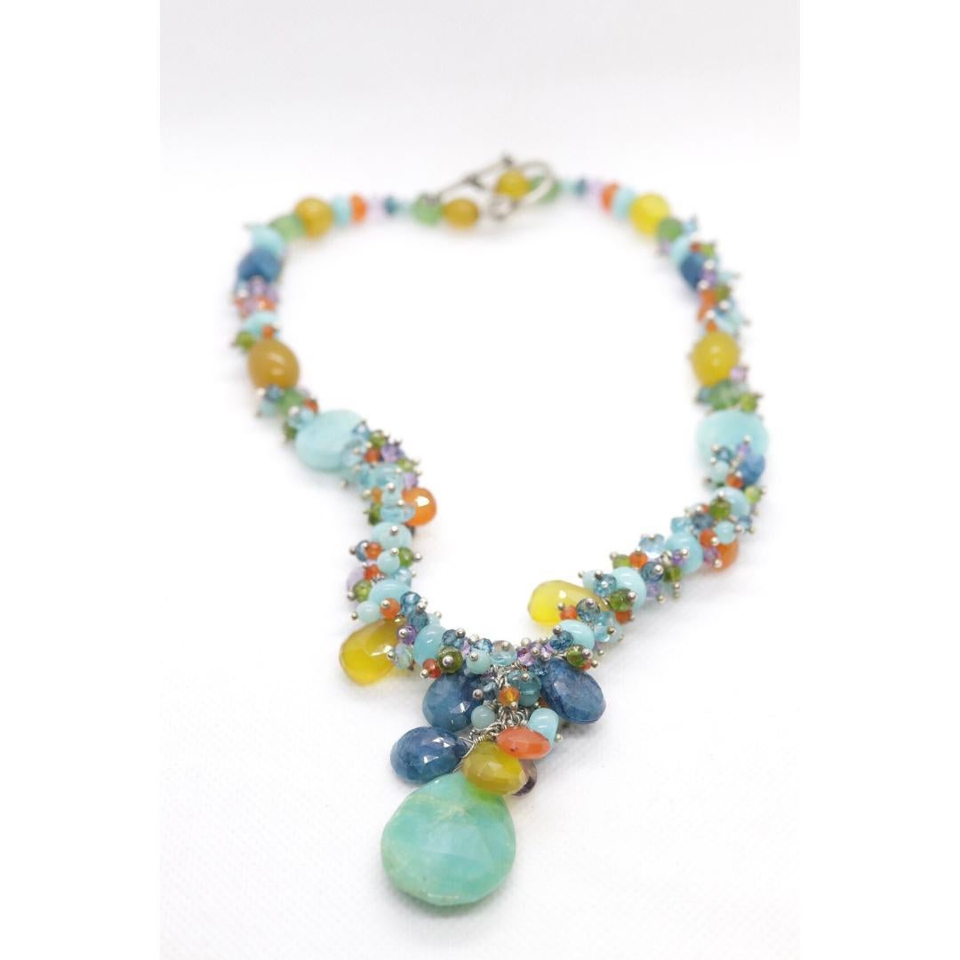 Vintage
Materials: Stone
Gemstone: Amazonite

Necklace length: 17 Inches

Amazing Laura Gibson Necklace. Sterling Silver Links and Closure. Sweet candy gems dangling in an artistic manner. Following gems are present: Amazonite, Amethyst,