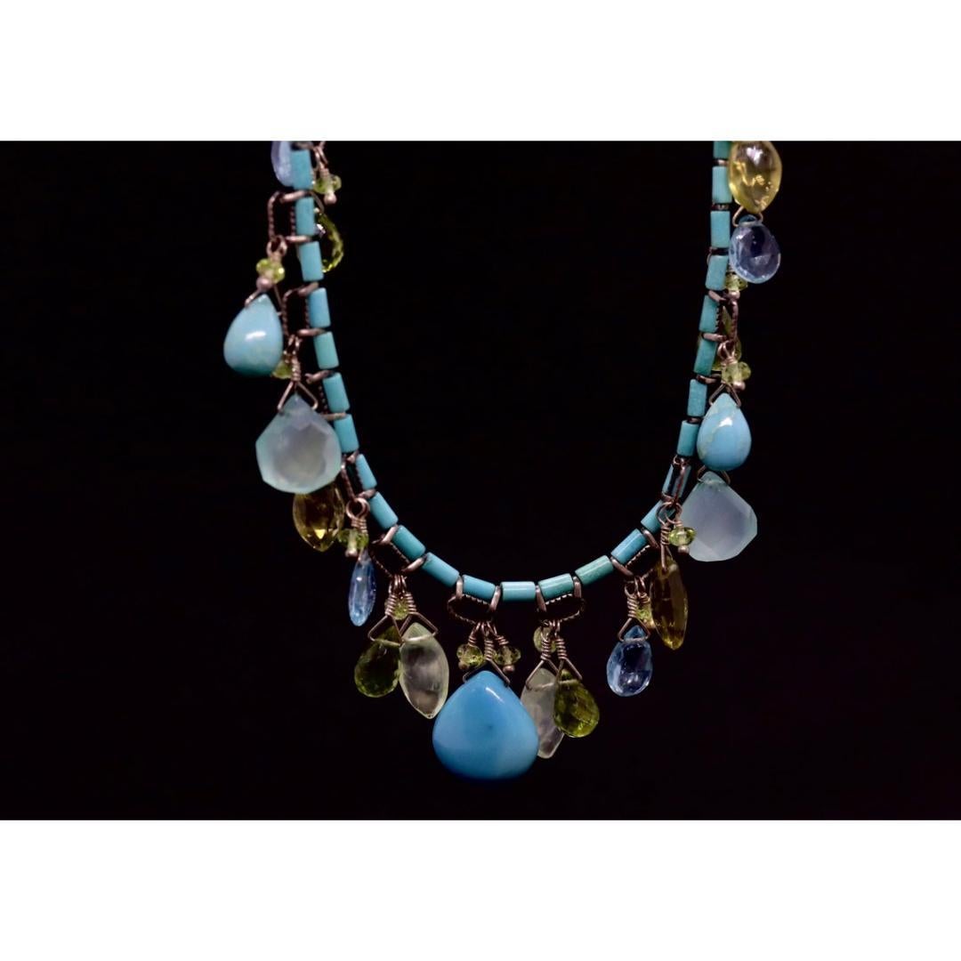Vintage
Materials: Stone
Gemstone: Chalcedony

Necklace length: 17 Inches

Amazing Laura Gibson Necklace. Sterling Silver Links and Closure. Sweet candy gems dangling in an artistic manner. Following gems are present: Apatite, Peridot, Opal