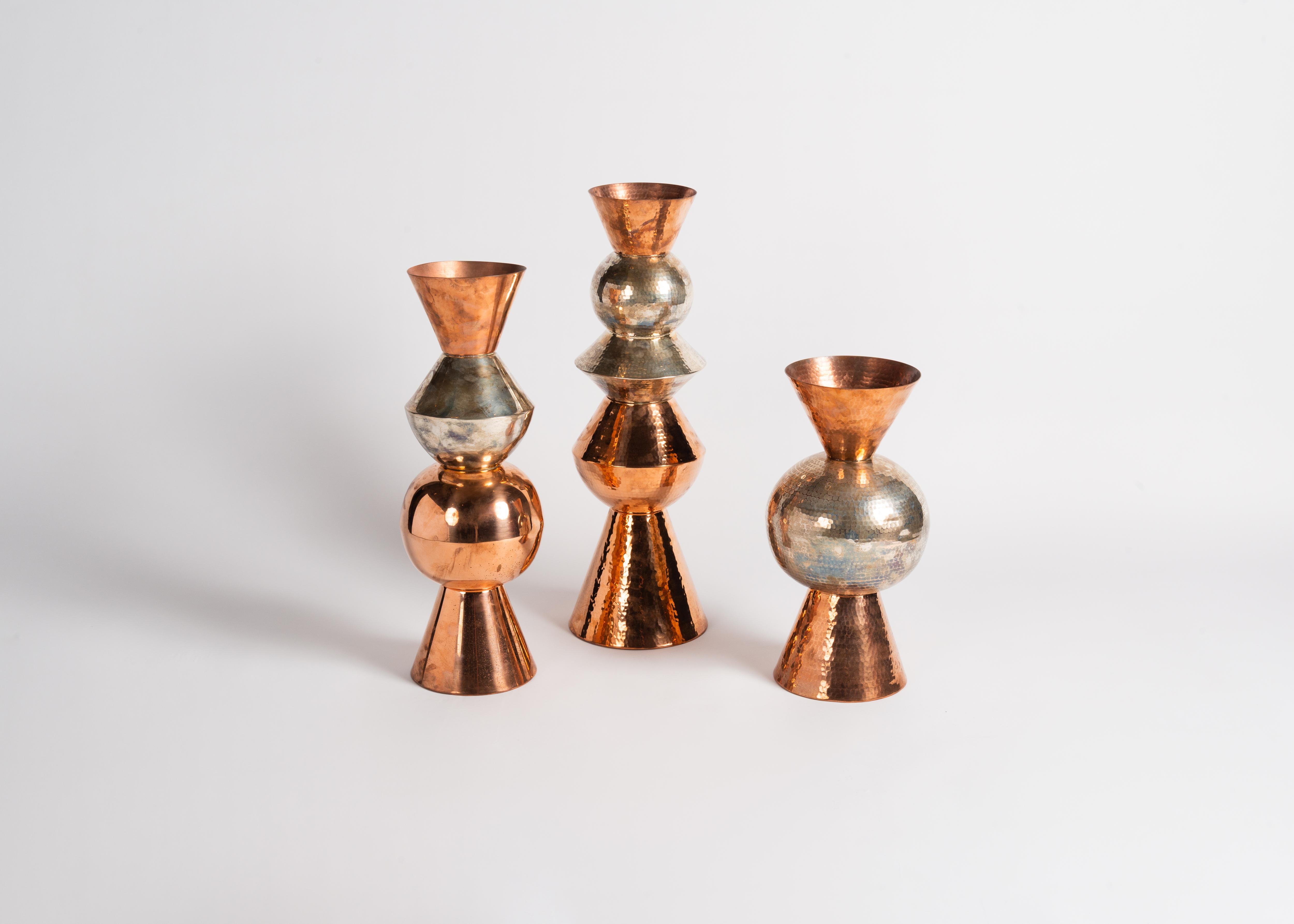 One of a series of beautiful, lobed vases created by American designer Laura Kirar in collaboration with 5th-generation artisans in Michoacan, Mexico. To create these remarkable pieces, raw copper is heated and hand hammered into shape before adding