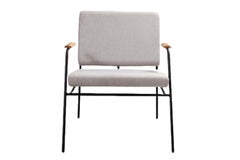 "Laura" Minimalist armchair in painted steel with wooden armrests
