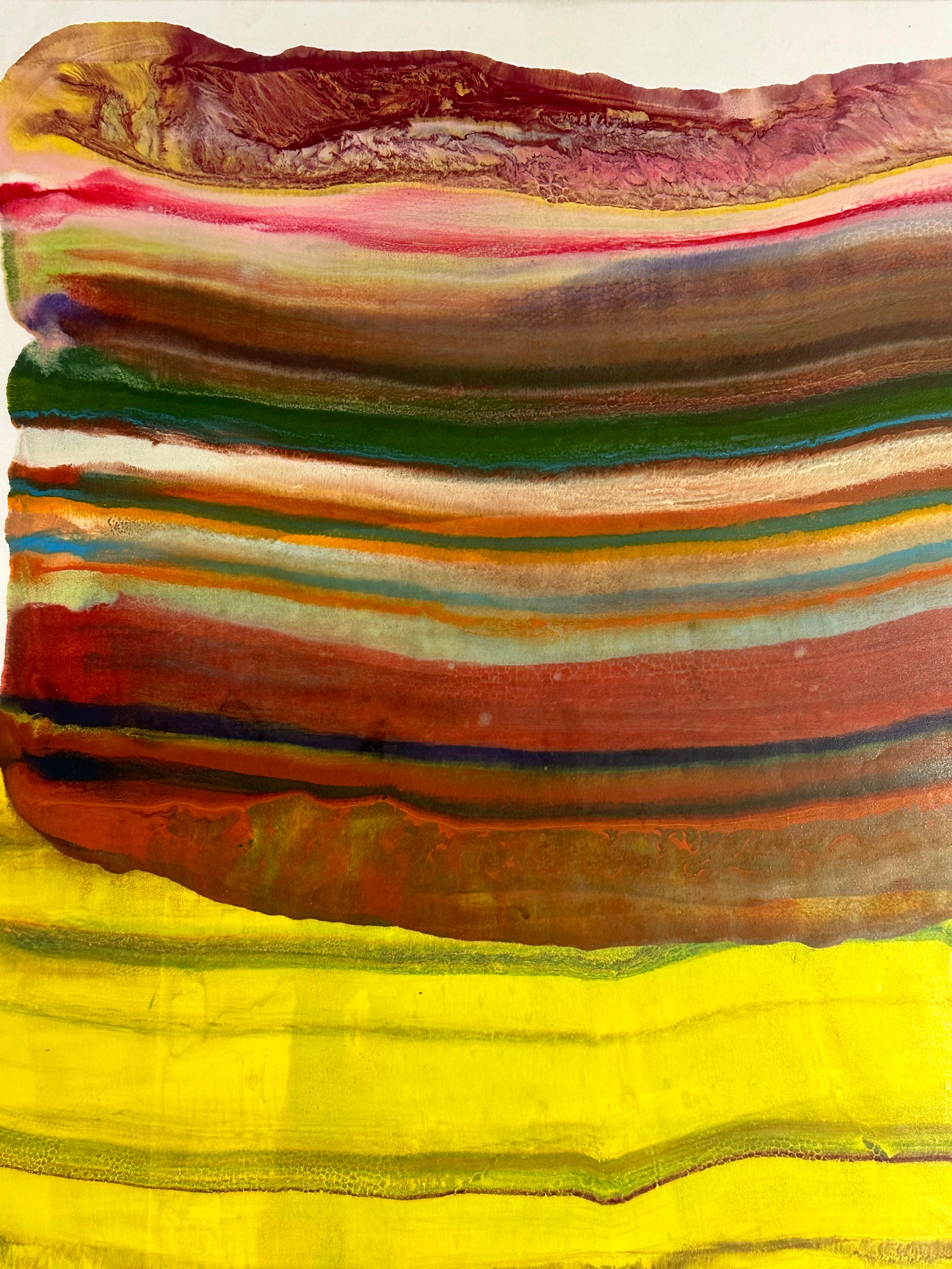 Laura Moriarty's Ex Uno Plures 8 is a multicolored encaustic monotype on kozo paper. Layers of pigmented beeswax on lightweight paper create an undulating composition suggesting layers of the earth's crust and geological formations depicted in pink,