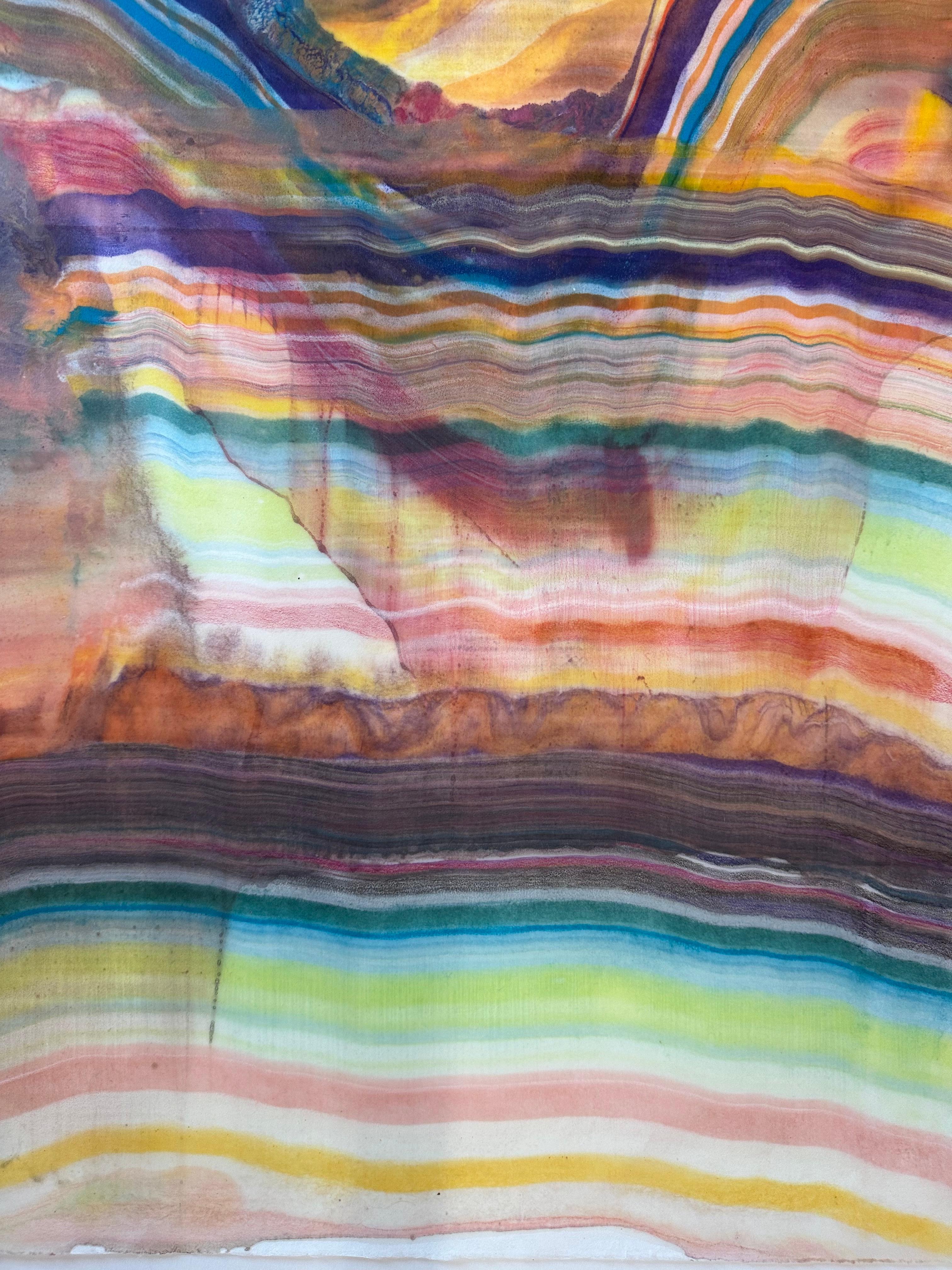 Laura Moriarty's Talking to Rocks 3 is a multicolored encaustic monotype on kozo paper. Layers of pigmented beeswax on lightweight paper create an undulating composition suggesting layers of the earth's crust and geological formations in orange,