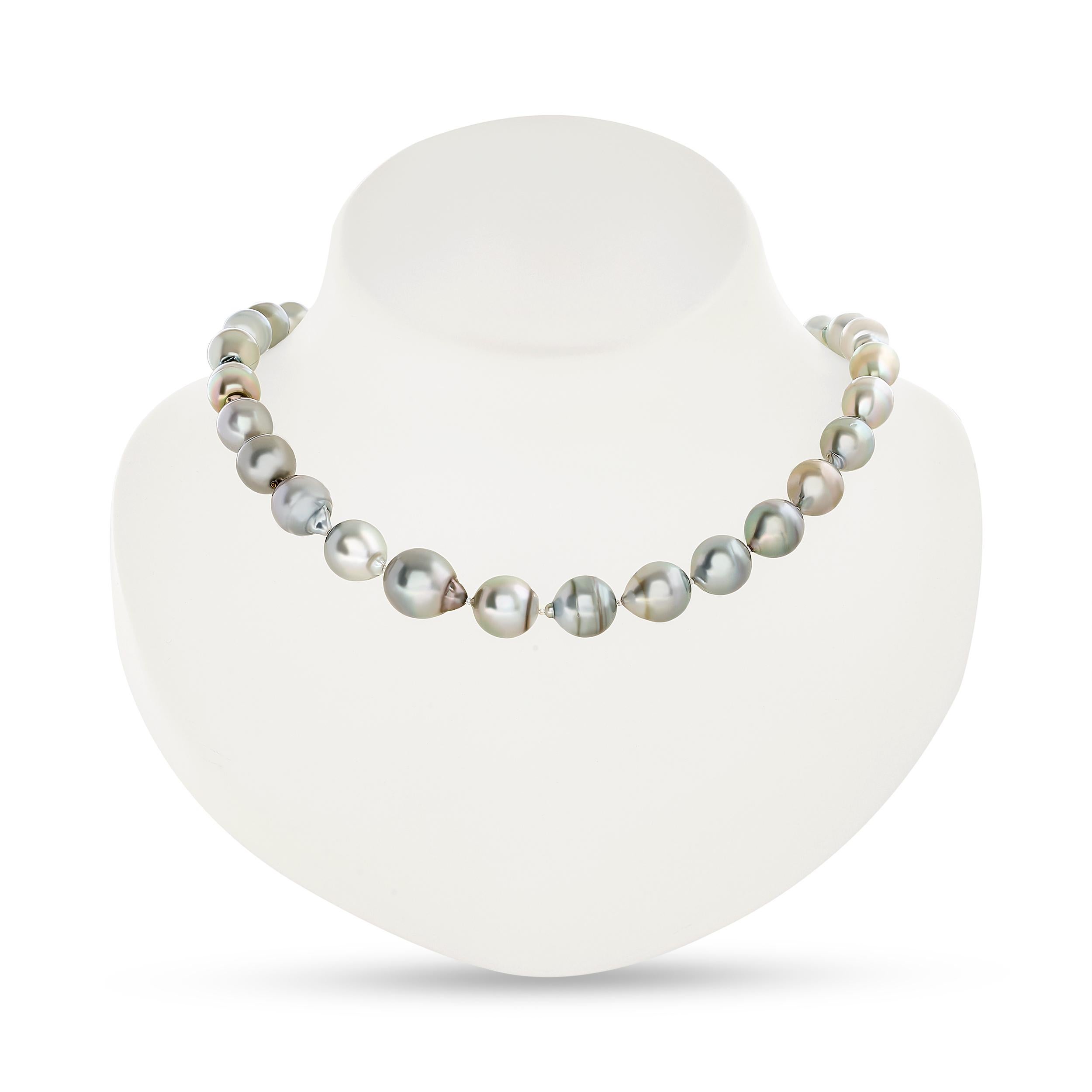 This Laura Munder necklace features lustrous gray pearls with a captivating blue topaz ball catch - in 18 karat white gold.
The 52 round blue topaz weigh approximately 4.25 total carat weight. 

The necklace weighs ~51.62 DWT.

It is stamped 