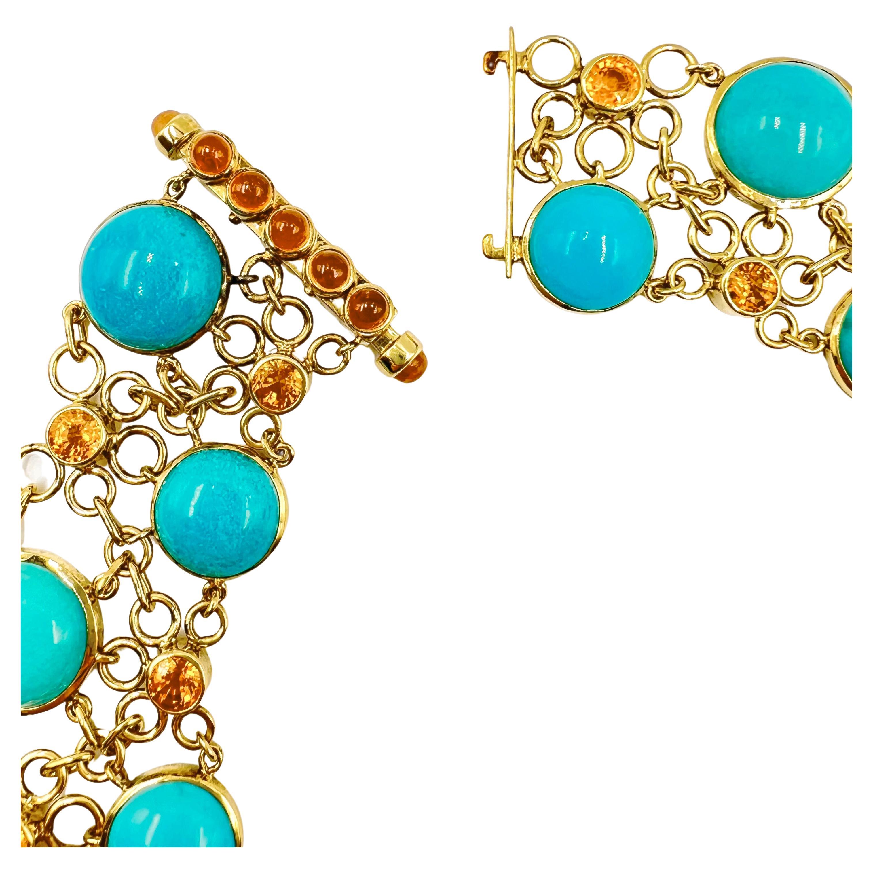 Interlocking polished 18k yellow gold circular links set with turquoise and citrine by Florida designer Laura Munder. Twenty-four round, cabochon cut, natural turquoise 13-15mm each. Accented by twenty-four 5mm round, mixed cut, natural citrine