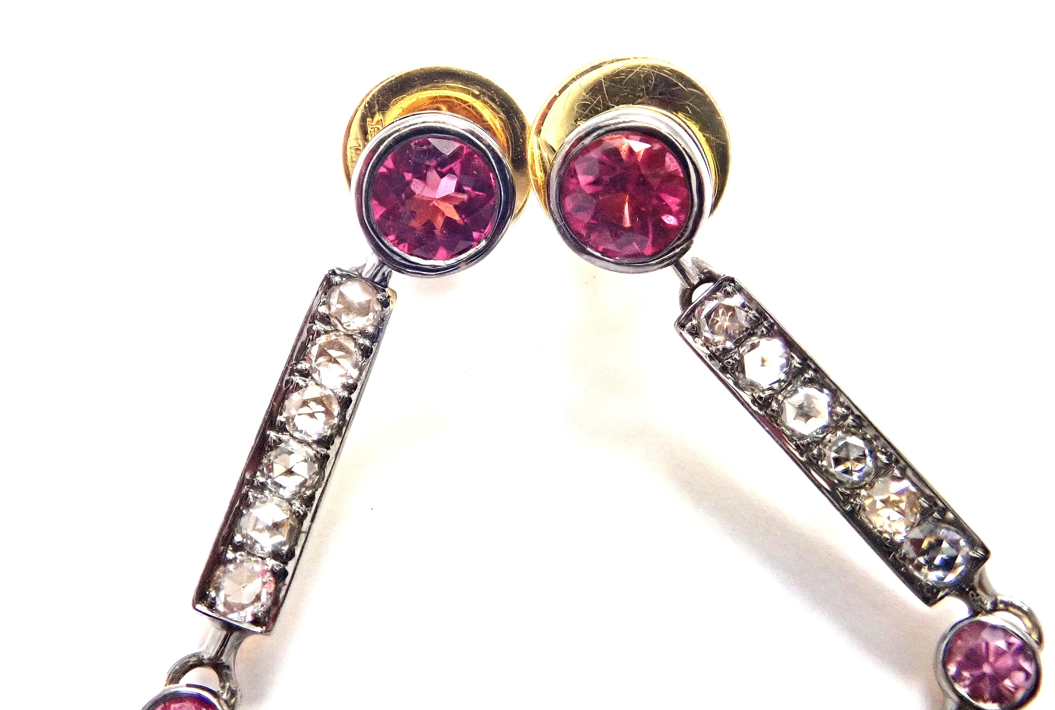18k Yellow Gold Diamond Pink Sapphire Dangle Earrings by Laura Munder. 
With 42 rose cut diamonds SI1 clarity, H color total weight approximately 1ct 
42 pink sapphires total weight approximately 7ct
These earrings are for pierced ears.
Details: