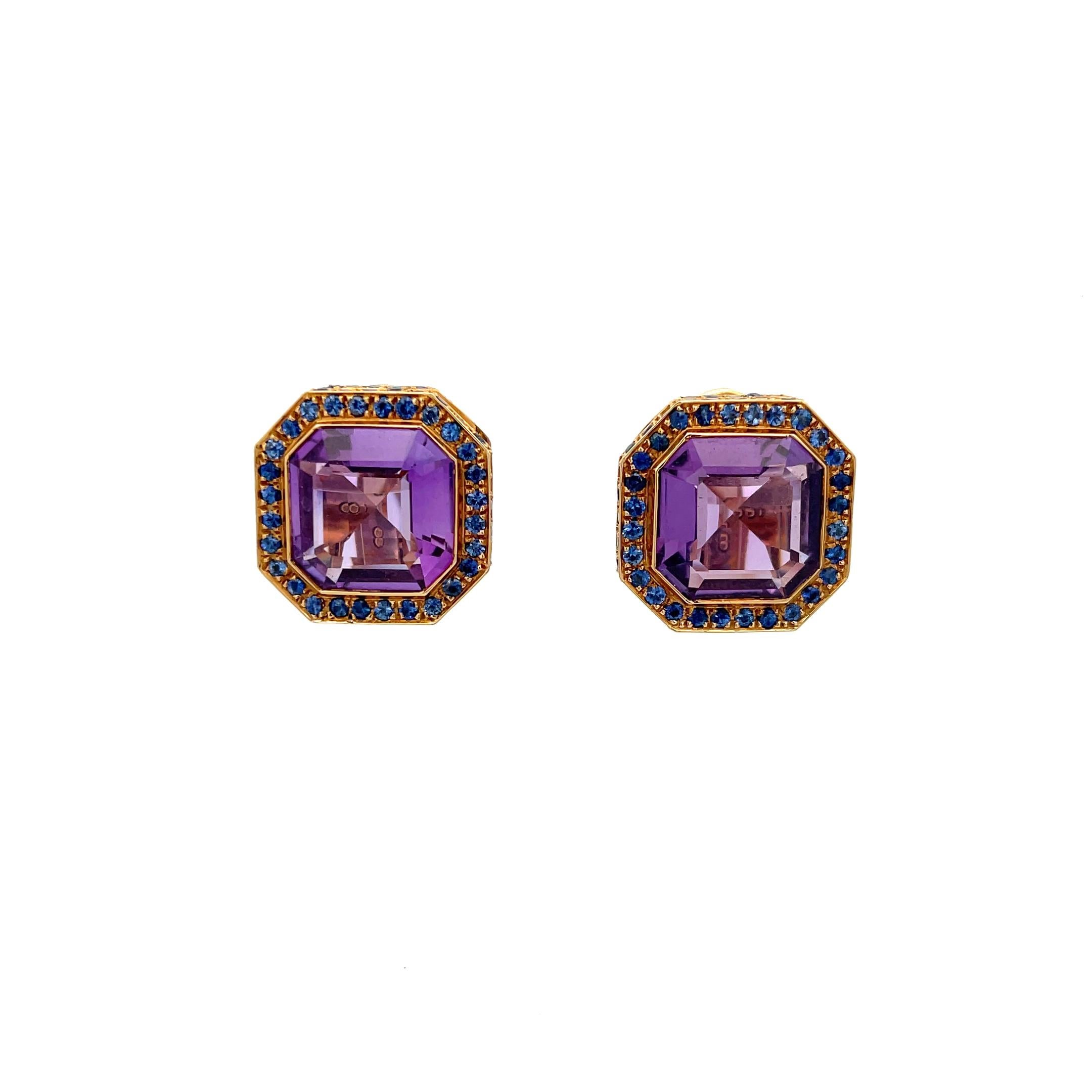 Laura Munder Octagon Amethyst and Blue Sapphire Earrings in 18K Yellow Gold. The earrings are clip-on, have a diameter of 1.75 inches, and weigh 21.3 grams.