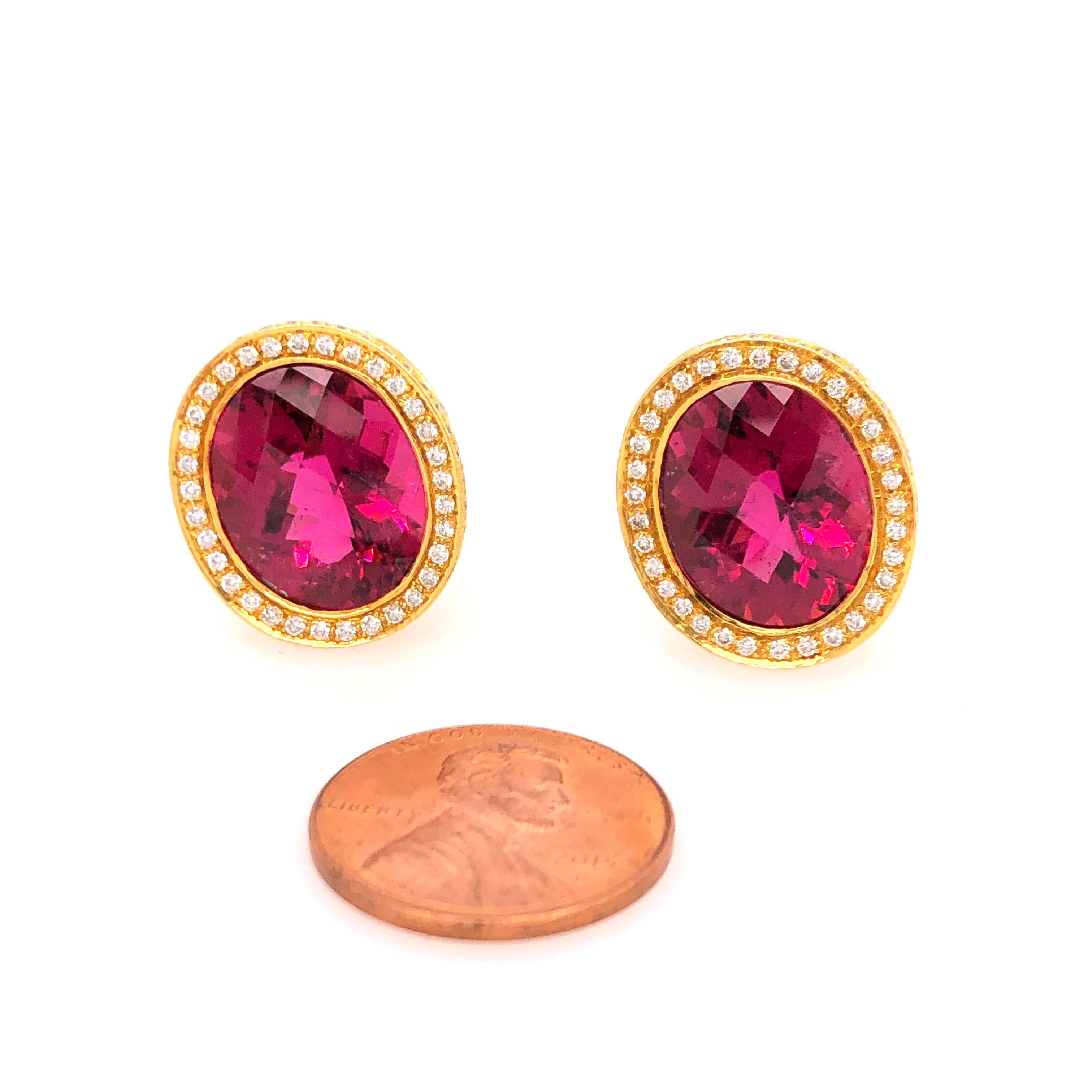 A wonderful flash of deep pink, Laura Munder's design is elegant but not afraid to be noticed. This matched pair of gem quality rubellites ( 10 CTS each ) are faceted and surrounded by diamonds (total diamond weight is approximately 3 CTS). The