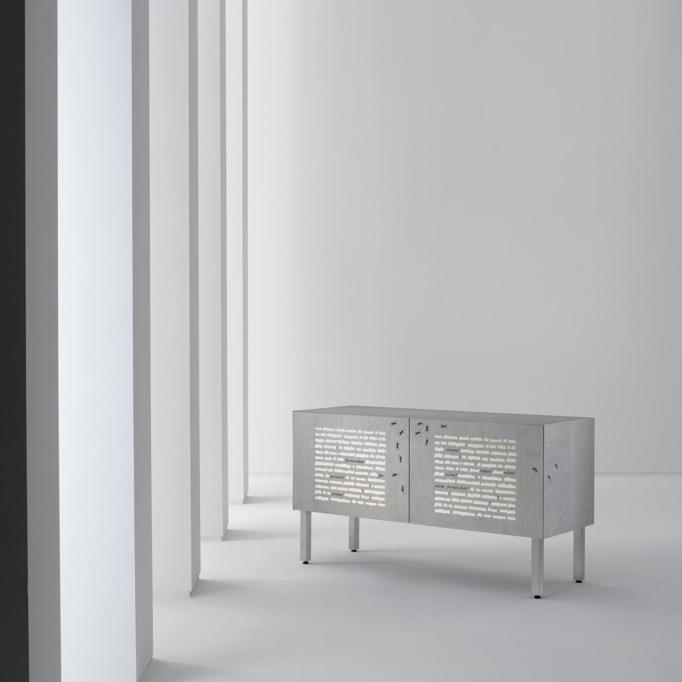 Sideboard with brushed metal legs and base, inlaid doors and structure. Fitted with push-pull doors and one internal shelf. It is also available in the hanging version.

FINISH:
Limited Edition Art Inlay

Thought the traditional “cancellature” (wood