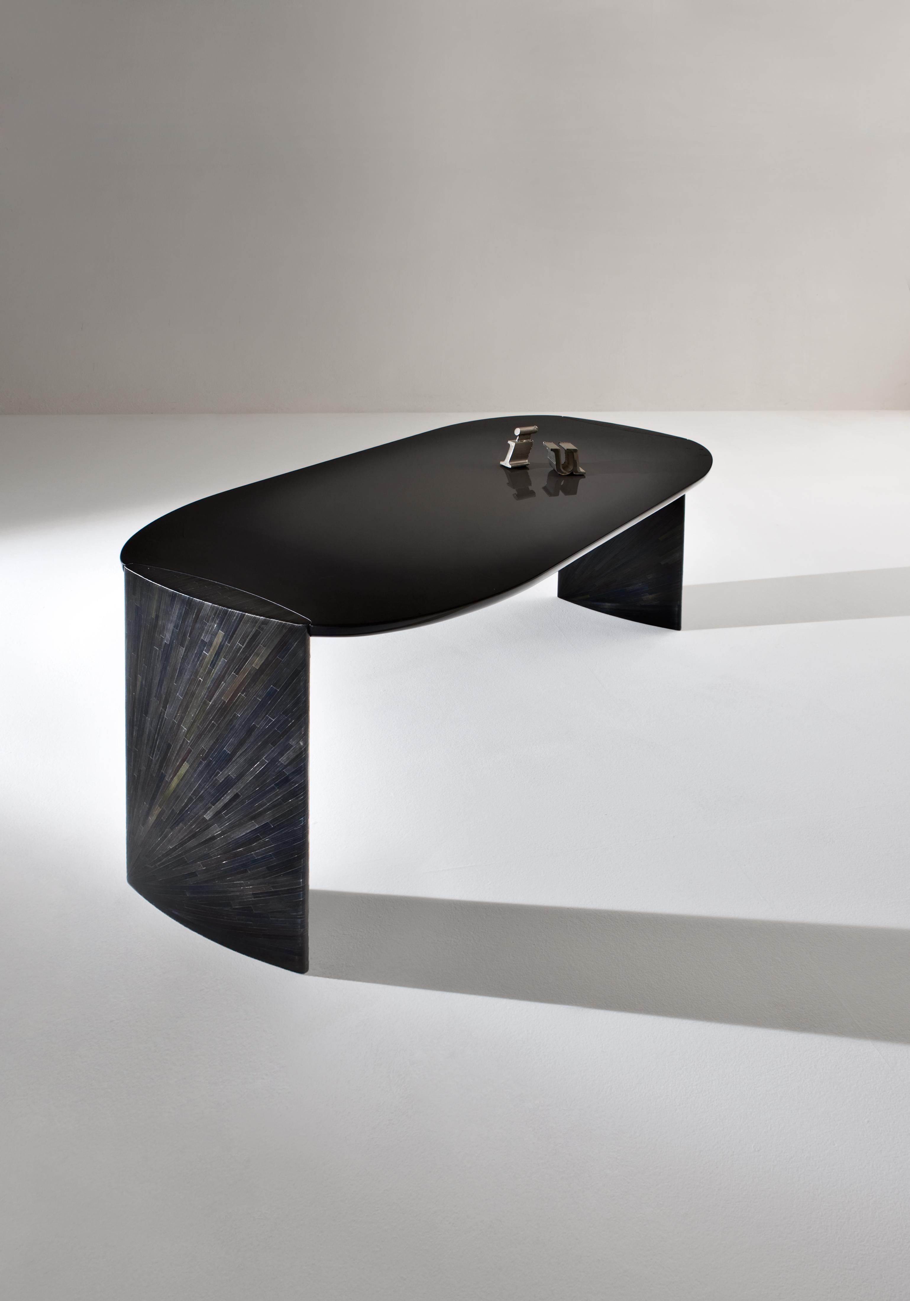 Family of desks with round-shaped top and legs with ovoidal section. Top in special shaded glossy lacquered wood and legs covered in a black rye-straw inlay.

Poe consoles stem from the desire to design a family of desks for contemplation, working