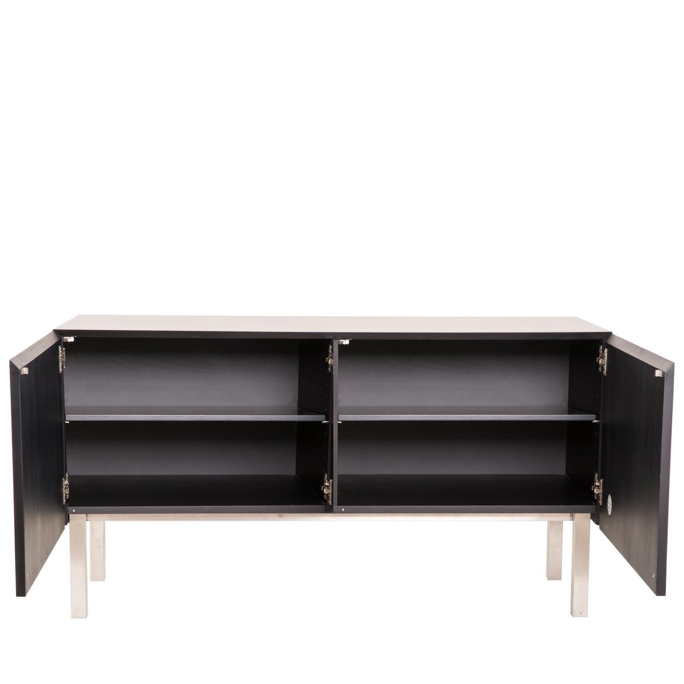 Sideboard with brushed metal legs and base, inlaid doors and matt lacquered structure in wood. Fitted with push-pull doors and one internal shelf. It is also available in the hanging version.

FINISH:
Limited Edition Art Inlay

For the author, this