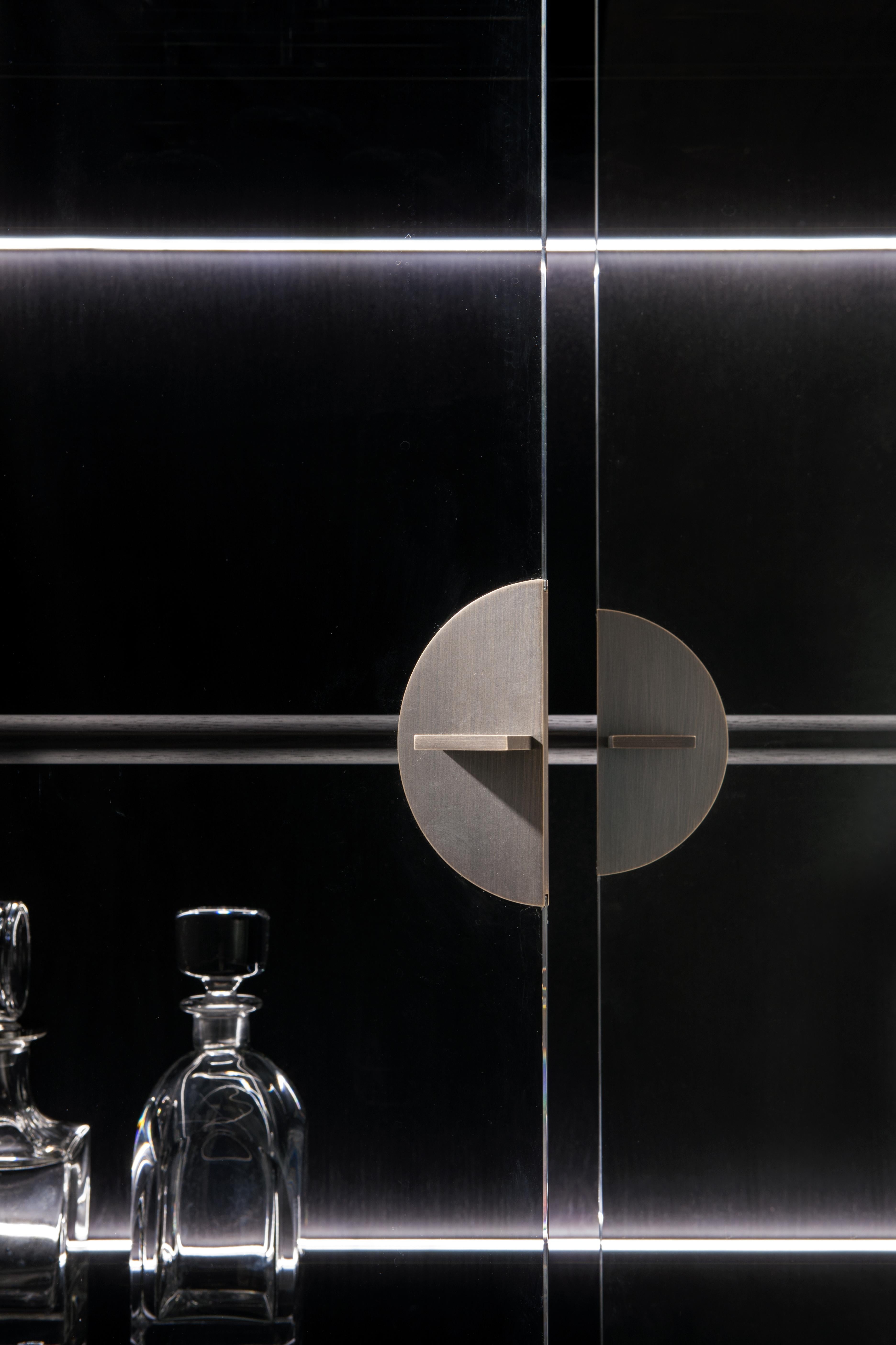 black tall cabinet with glass doors