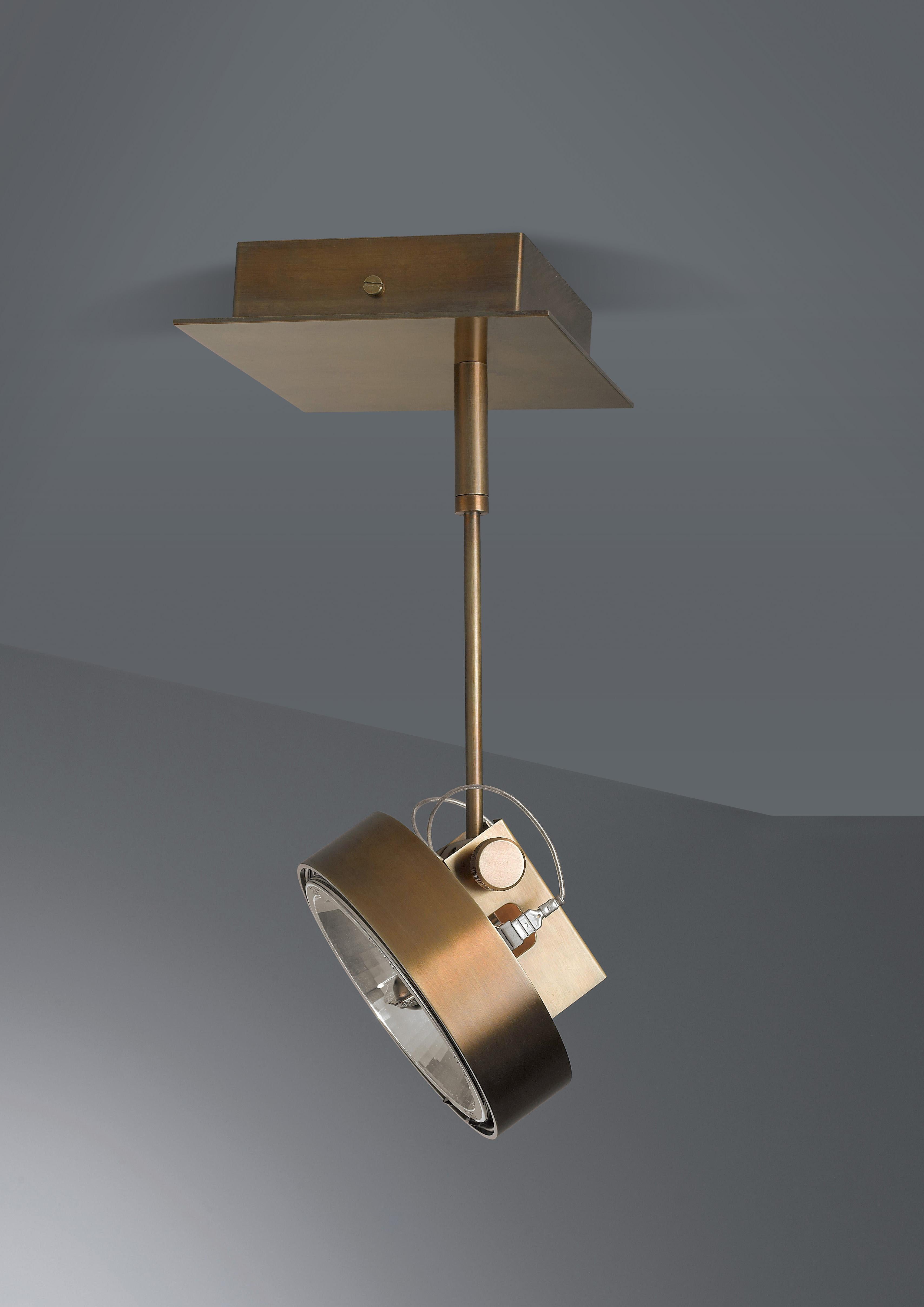 Adjustable LED spotlight for ceiling or wall fastening in DARK burnished brass.

The sophisticated design and the choice of the finest materials are the distinctive elements of our Lamps. Particular attention is paid to metals, especially copper and