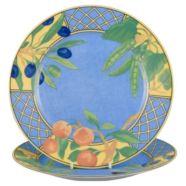Laure Japy, París / Limoges, Francia. Dos platos de porcelana. Motivo frutal.