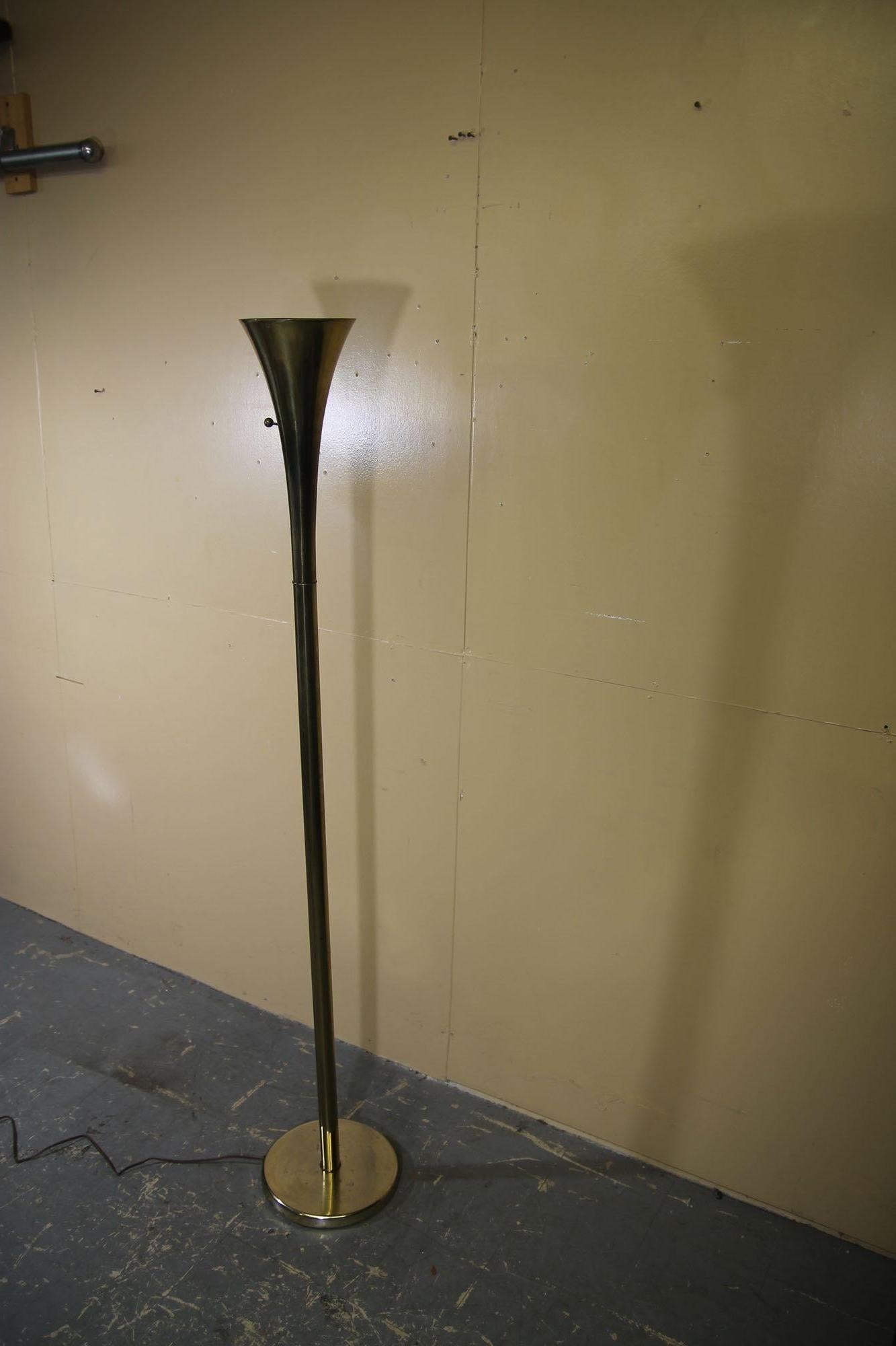 Brass Torchiere by the Laurel Lamp Co. Lamp is in nice vintage condition. Some wear to the metal on base and pole but does not distract from the great look of this floor lamp.