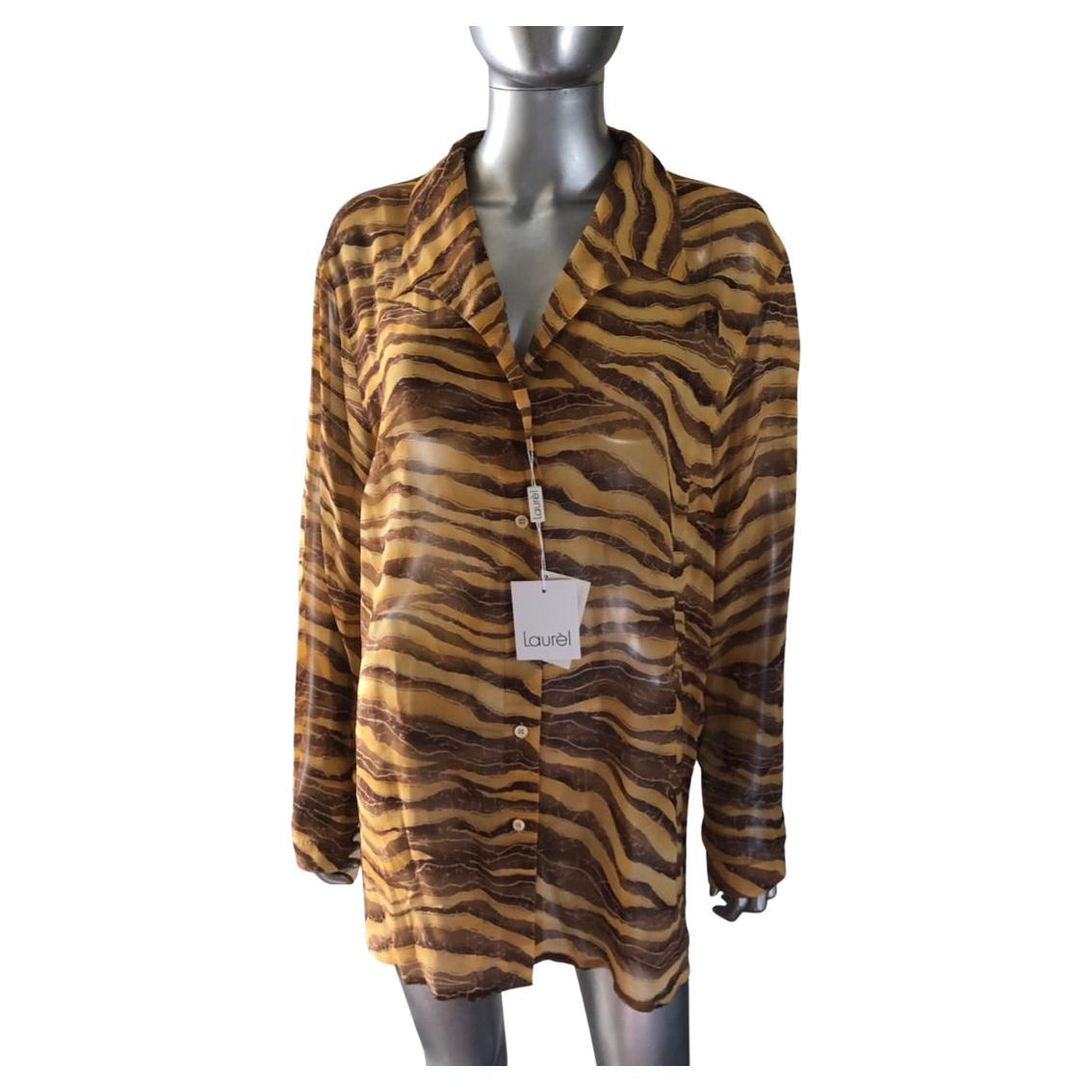 This blouse is so chic and modern. A vintage find in the closet of a Palm Springs Fashionista, NWT., never worn. The fabric is a European chiffon in a zebra animal brint of golds and browns. Made in Czech Republic. Rare size 44 Euro or size 14 US.