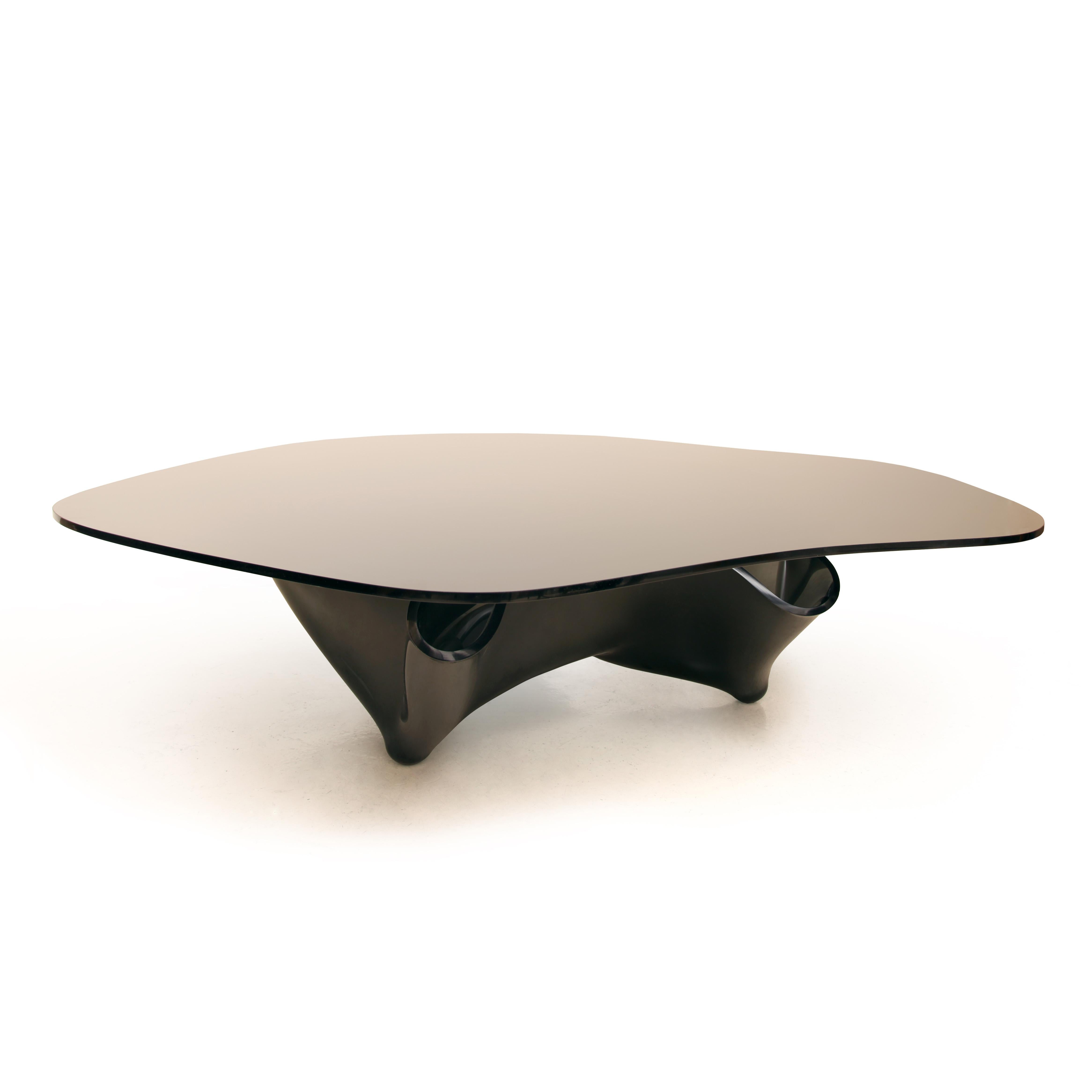 A monumental and rare black glass coffee table, with handkerchief-shaped base and irregular organic shape glass top. Imported from the USA to London, originally for an estate in Hyde Park. This piece was produced prior to 1992, when Fyfe owned Lumen