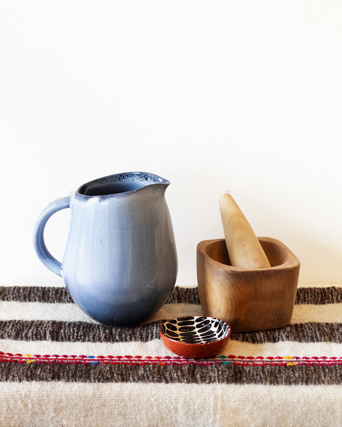 This beautiful Laurel Hand Carved Solid Wood Mortar and Pestle is crafted from solid wood, creating a warm, natural look perfect for any rustic or organic-modern kitchen. Its minimalist, artisanal design makes this cooking tool the perfect practical