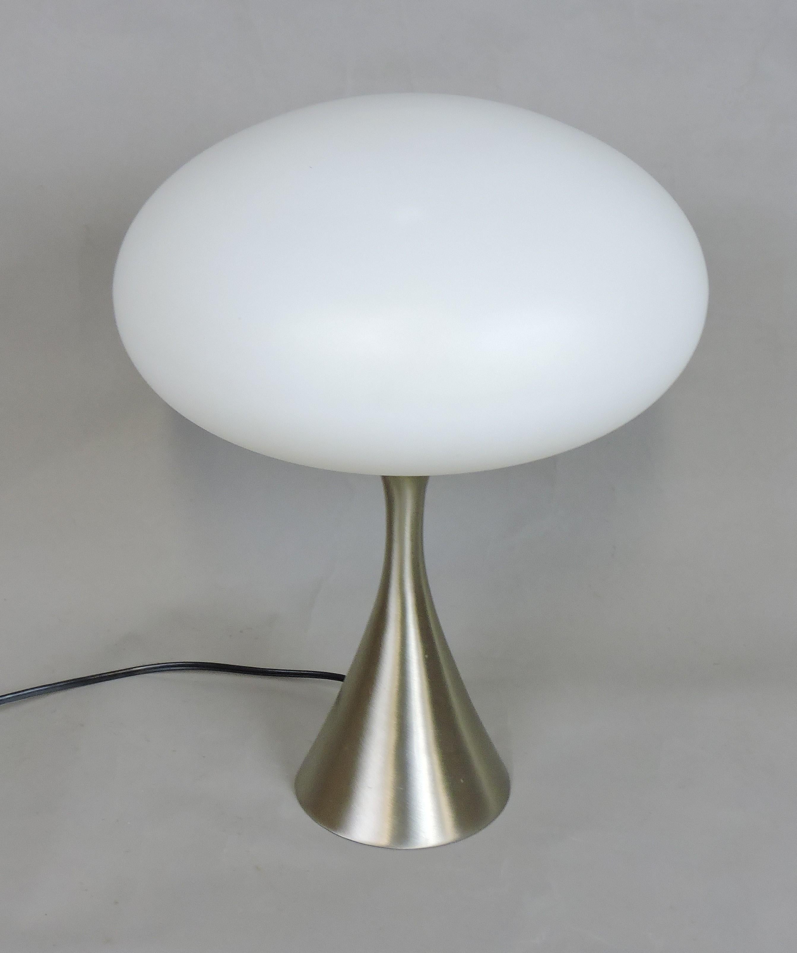 Classic and iconic mushroom table lamp made by high quality lighting manufacturer, Laurel Lamp Company of Newark, NJ. This heavy and well-made lamp has a brushed chrome base with the original frosted hand blown glass shade. It has the original label