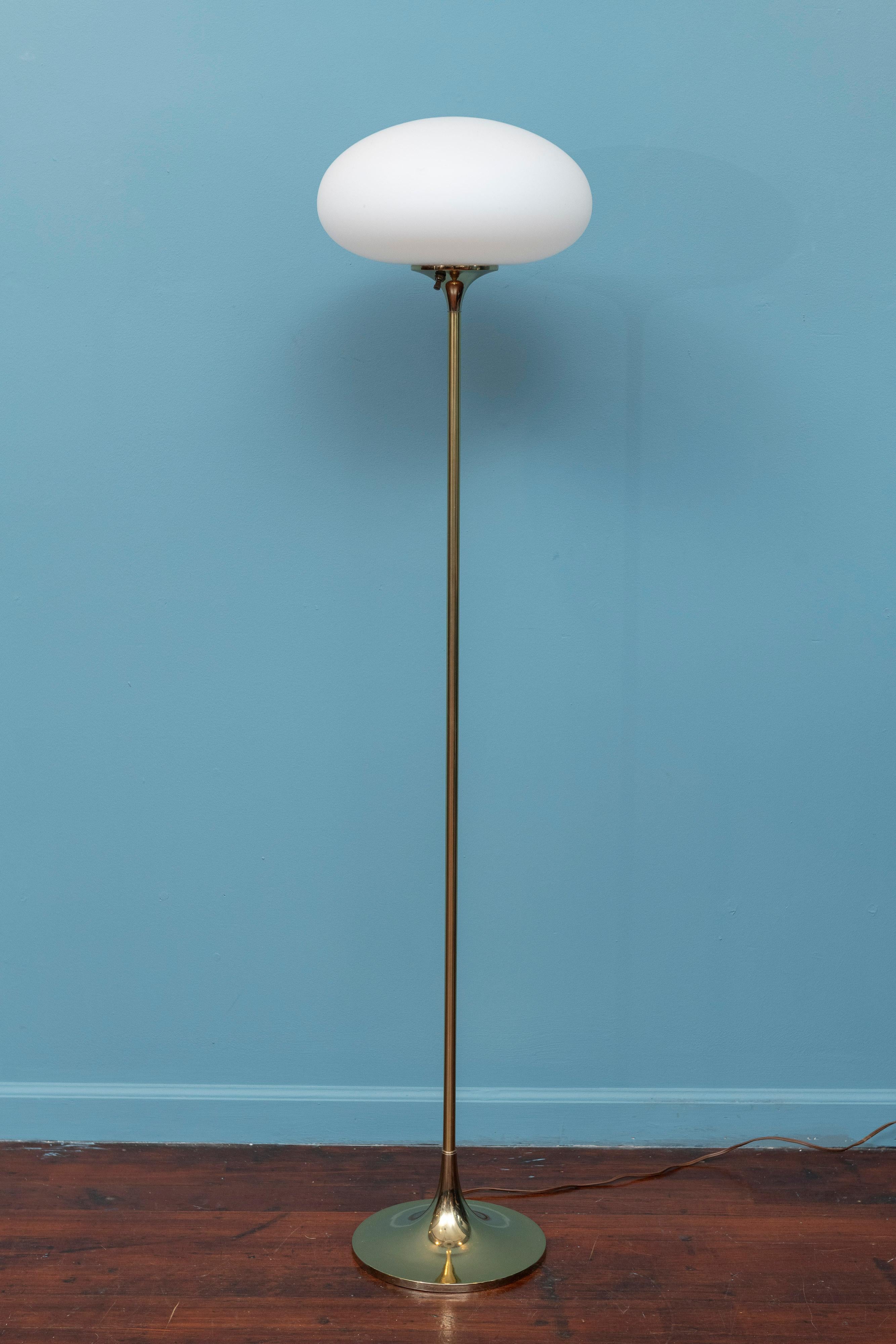 Laurel Lamp Company brass floor lamp. Elegant lamp with three way switch for 50W, 75W or 100w options. In good original condition, the original shade is clean from scratches or chips with only minor scuffs to the base. Ready to install and enjoy.