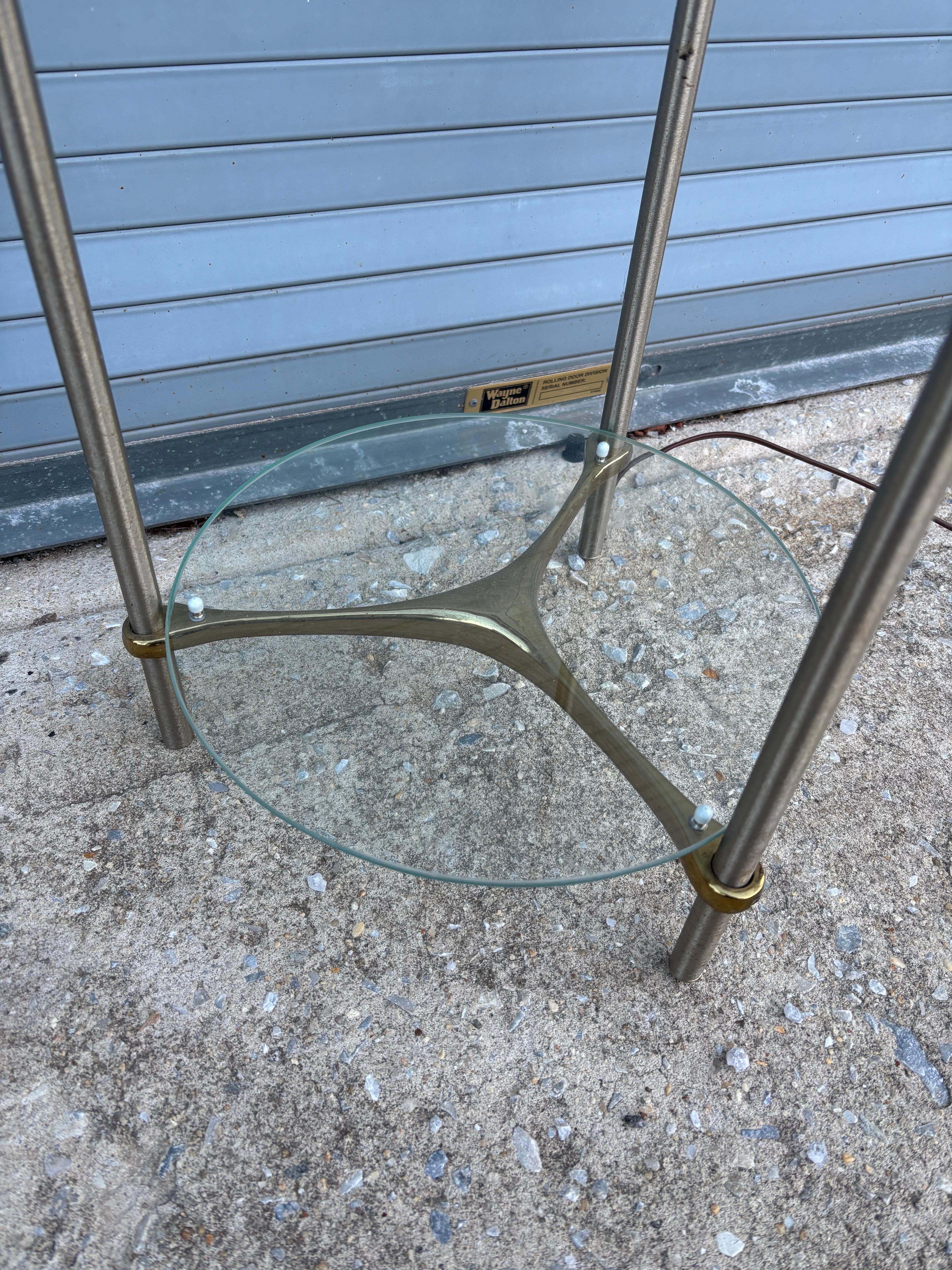 Laurel Lamp Company Display Floor Lamp.  Two glass shelves that  can be adjusted and moved up and down to allow for display of large or small items.  In-Line Switch on cord.  Glass Ball Shade gives a nice quality of mod inspiring light!  New glass