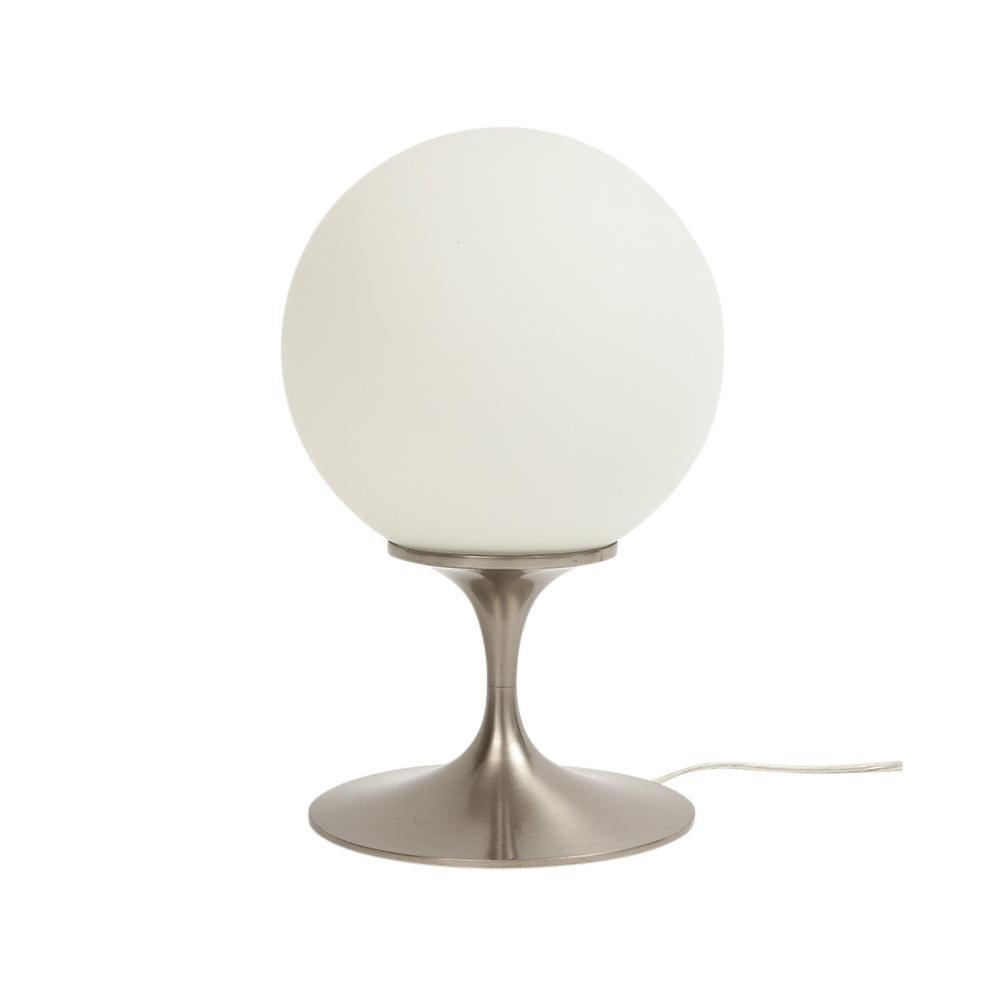 Laurel Lamp, Frosted Glass, Brushed Chrome-Plated Steel, Signed. Small scale swinging 1960's table with brushed chrome tulip form base and a white frosted glass globe shade. Molded manufacturer's mark on the underside: ‘US Pat DES 199141' and decal