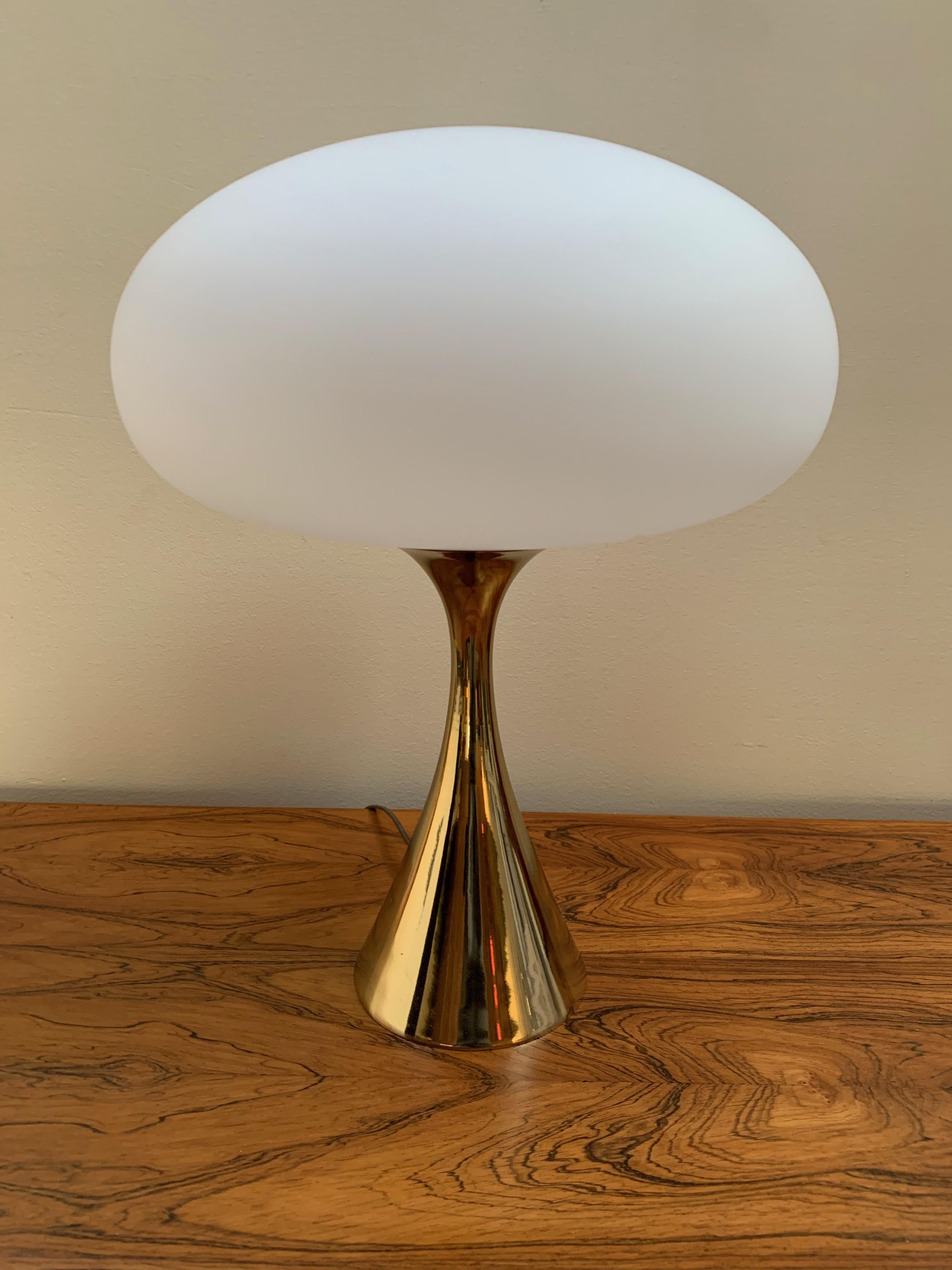This icon of midcentury design, done in brass with an opaque italian glass shade is in wonderful condition.