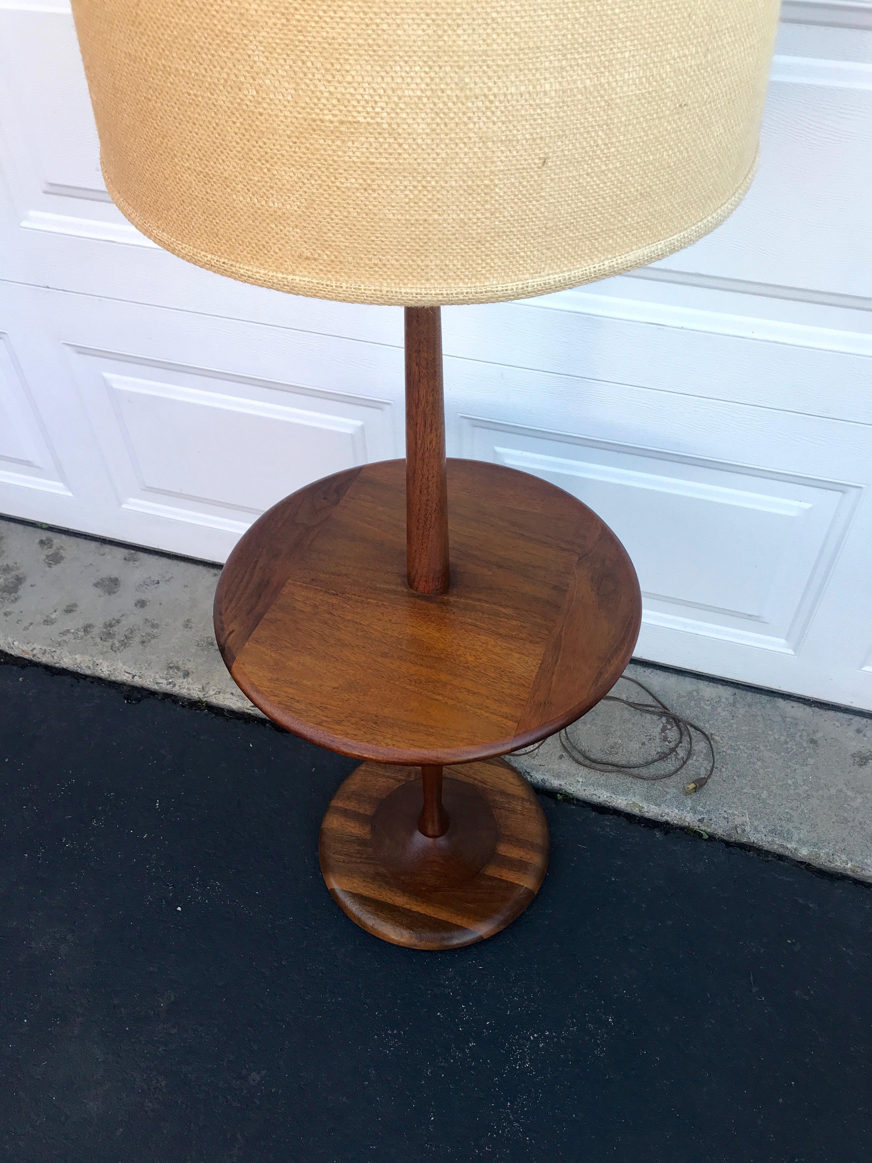 Modern floor lamp designed and manufactured by Laurel Lamp Co. in the United States, circa 1960s. This sleek, Minimalist design features a tall walnut wood body with a circular slate table surface and base that gives stability and style to the