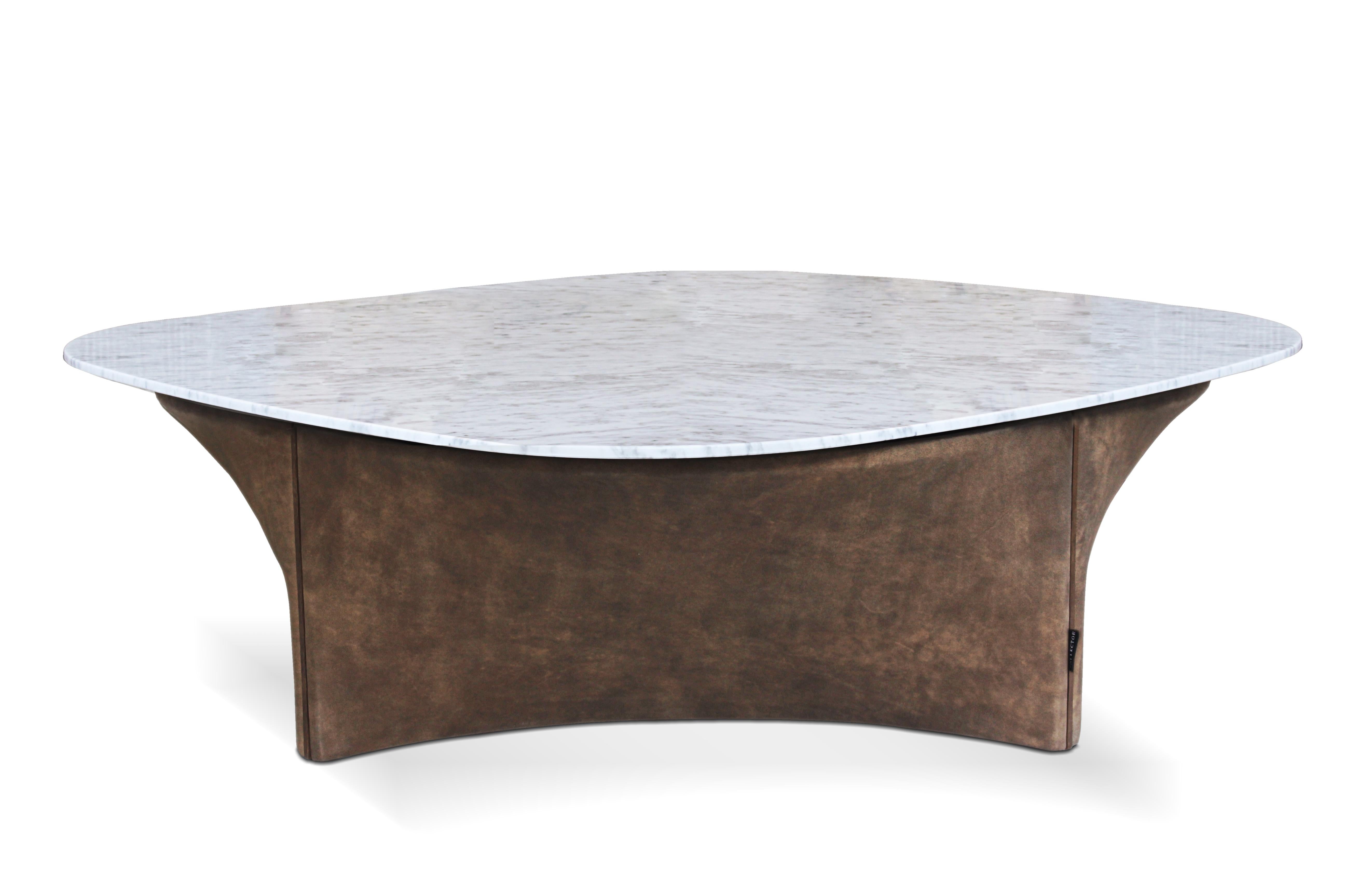 Lauren center table by Collector
Materials: Base structure upholstered in leather with wood details. Marble top.
Dimensions: W 115 x D 115 x H 35 cm

A center table with special light reflections that enhance the exclusive quality of the leather