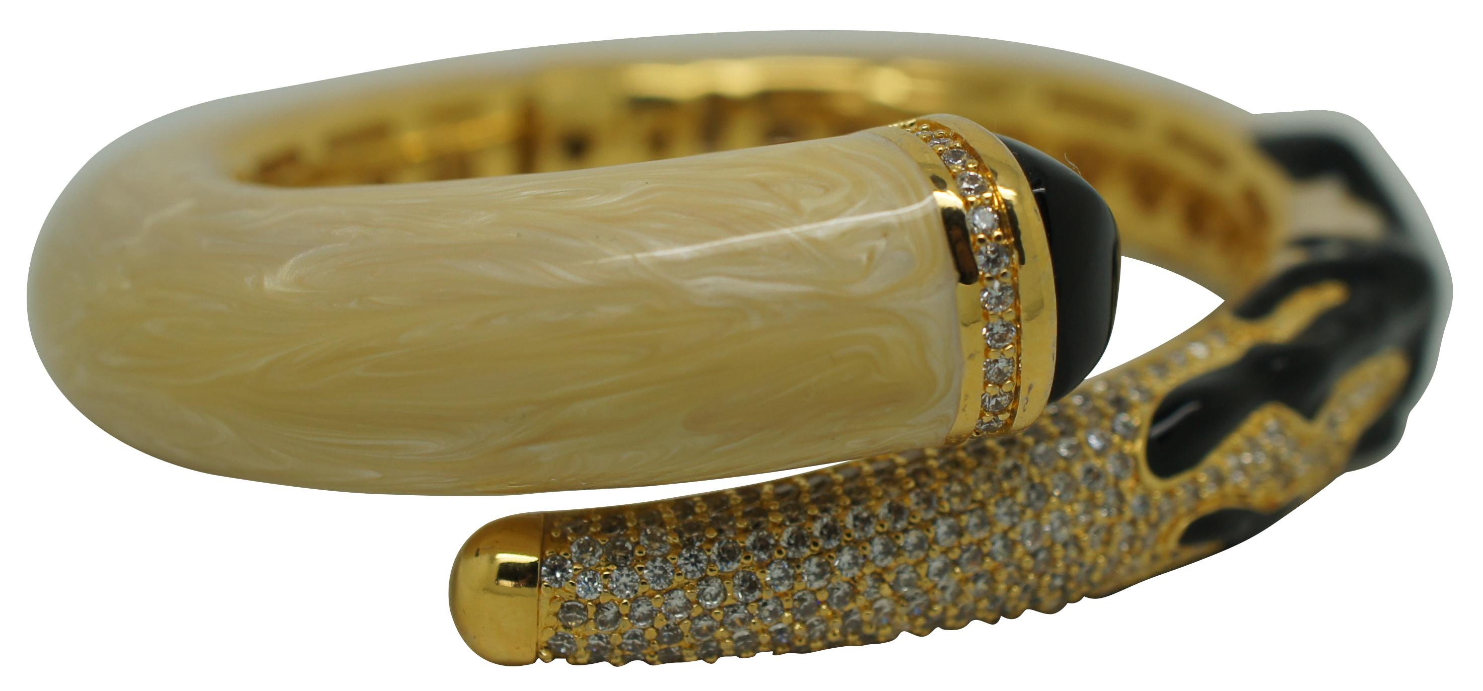 Elegant spring hinge bangle bracelet by Lauren G. Adams featuring swirling off white enamel with coral shaped black enamel accents, encrusted with white pave cubic zirconia and tipped with faceted black onyx on a brass and 18K gold plated