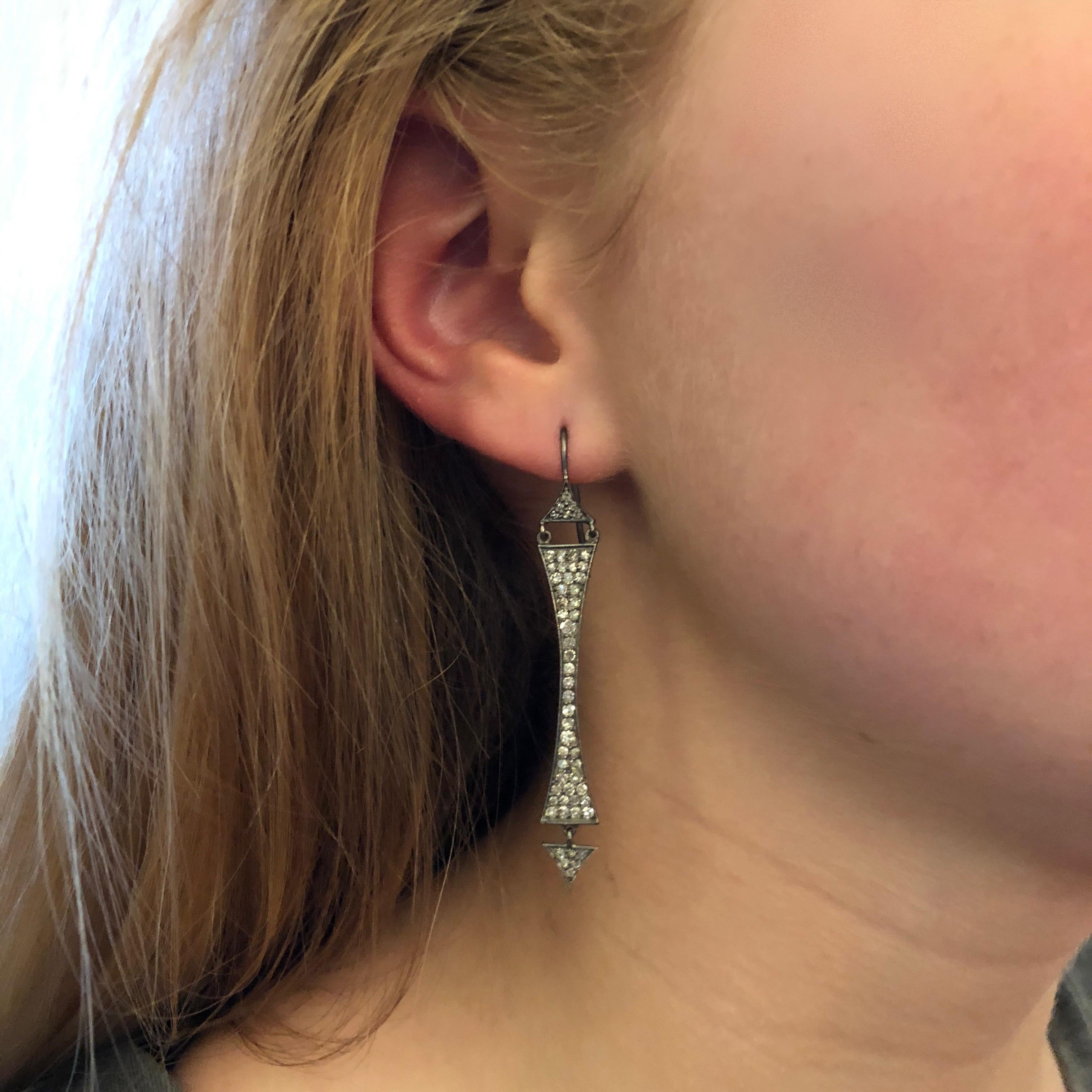 These dramatic sparkly white diamond and black silver earrings are sure to get you noticed.  Finished with black Rhodium over fine silver, these earrings will keep their blackened color forever.  Lightweight enough for all day wear, but definitely