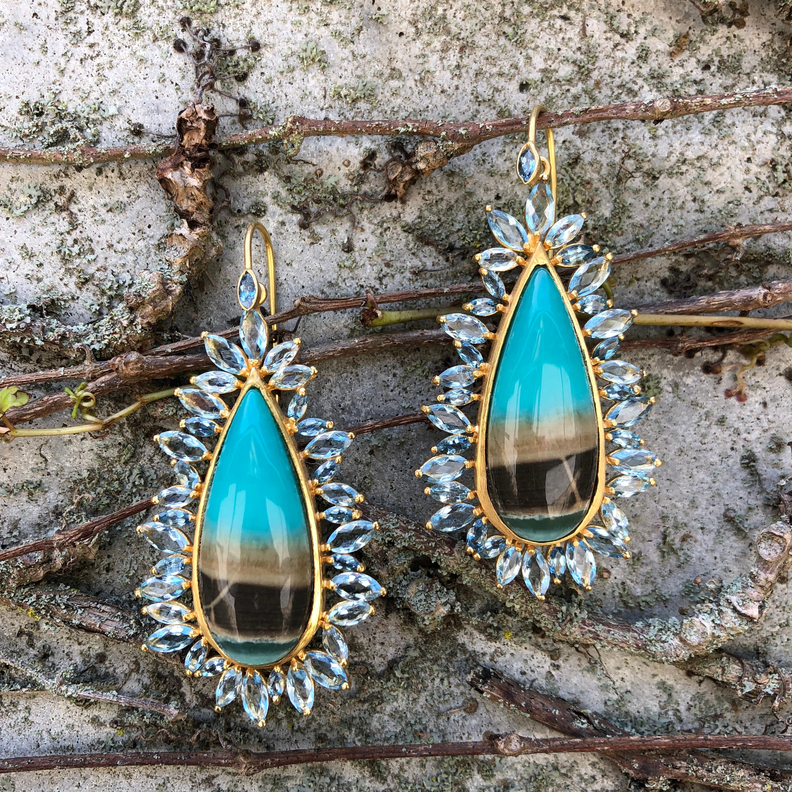 These stunning pear shaped earrings have unique Opalized Petrified Wood in the center with marquise shaped Aquamarine flames surrounding them.  Set in Lauren Harper's signature 18kt matte Gold, these earrings are a perfect compliment to any outfit.  