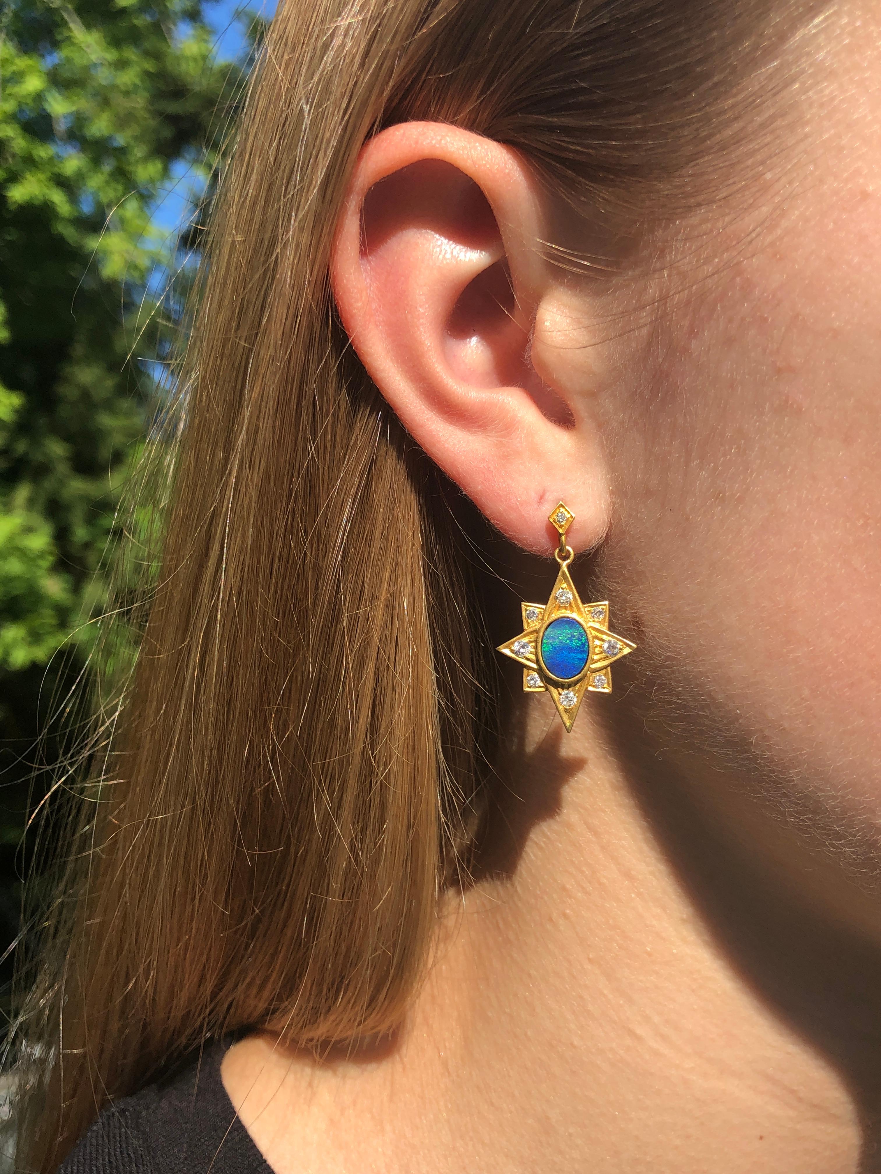 These brilliant blue Boulder Opals are surrounded by .53cts Diamonds and set in a 18kt Gold star formation.  Lightweight and easy to wear all the time, these earrings are the perfect way to finish an outfit, day or evening appropriate.  Available in