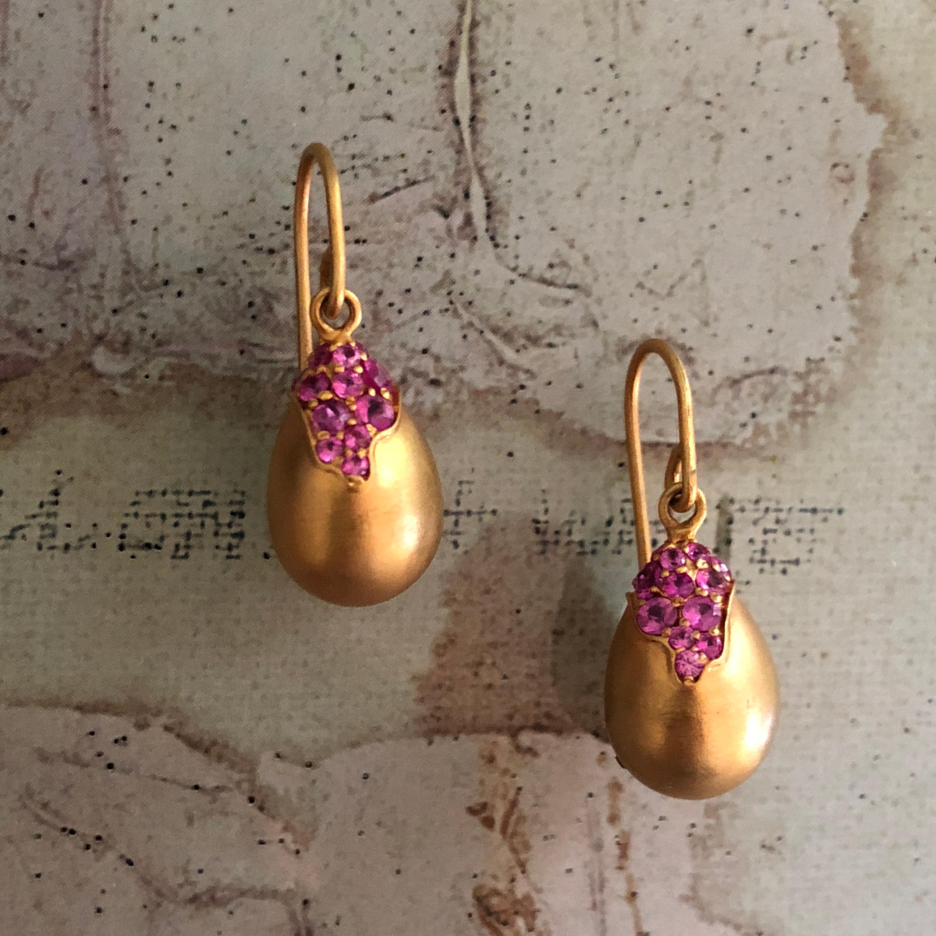 These Pink Sapphire and 18kt Gold drop earrings are a timeless classic that will add a special touch to your outfit on any occasion.  Beautiful faceted round Pink Sapphires are designed to look like they are dropping from the top of the pear. 